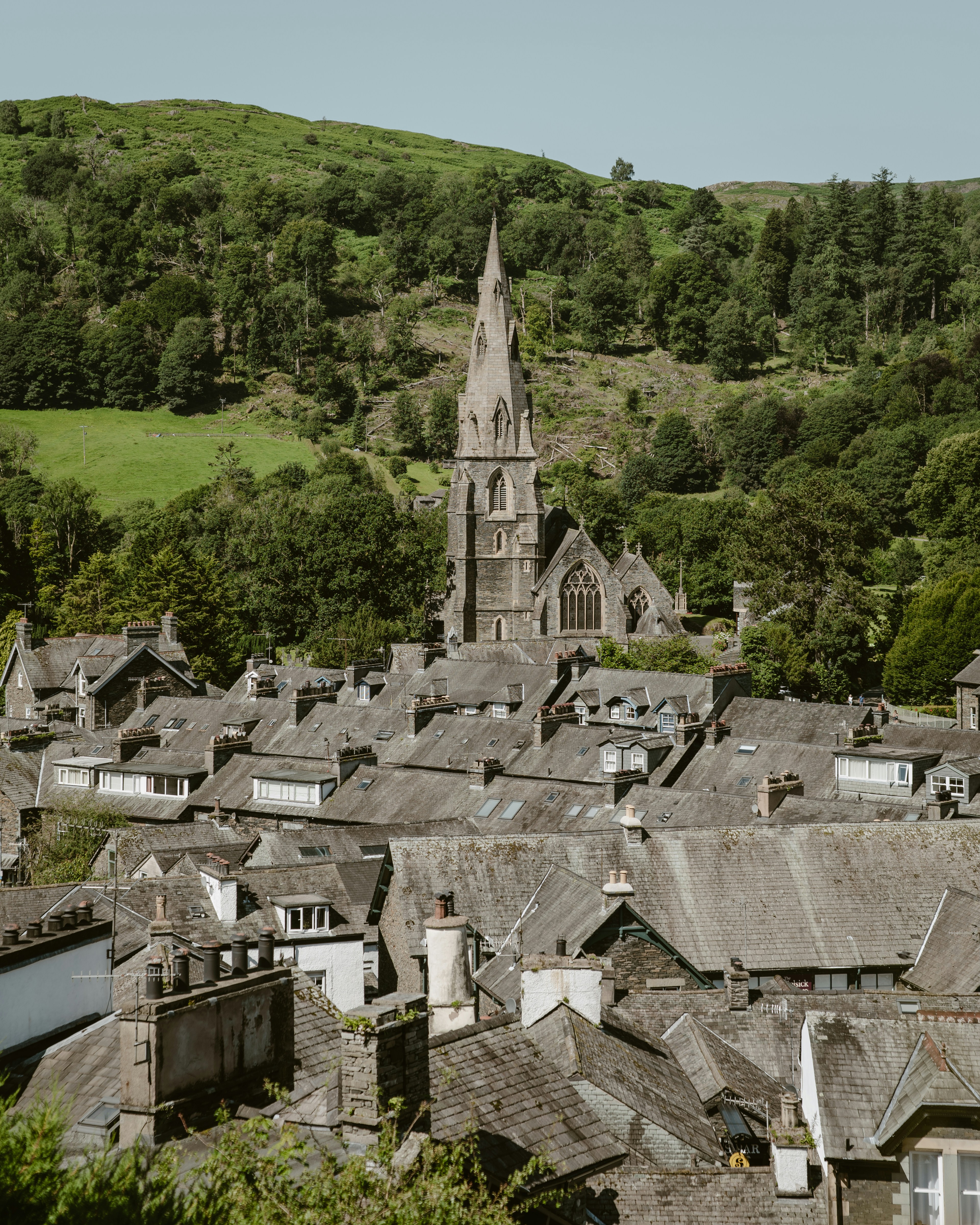 A quaint village with a prominent church steeple.