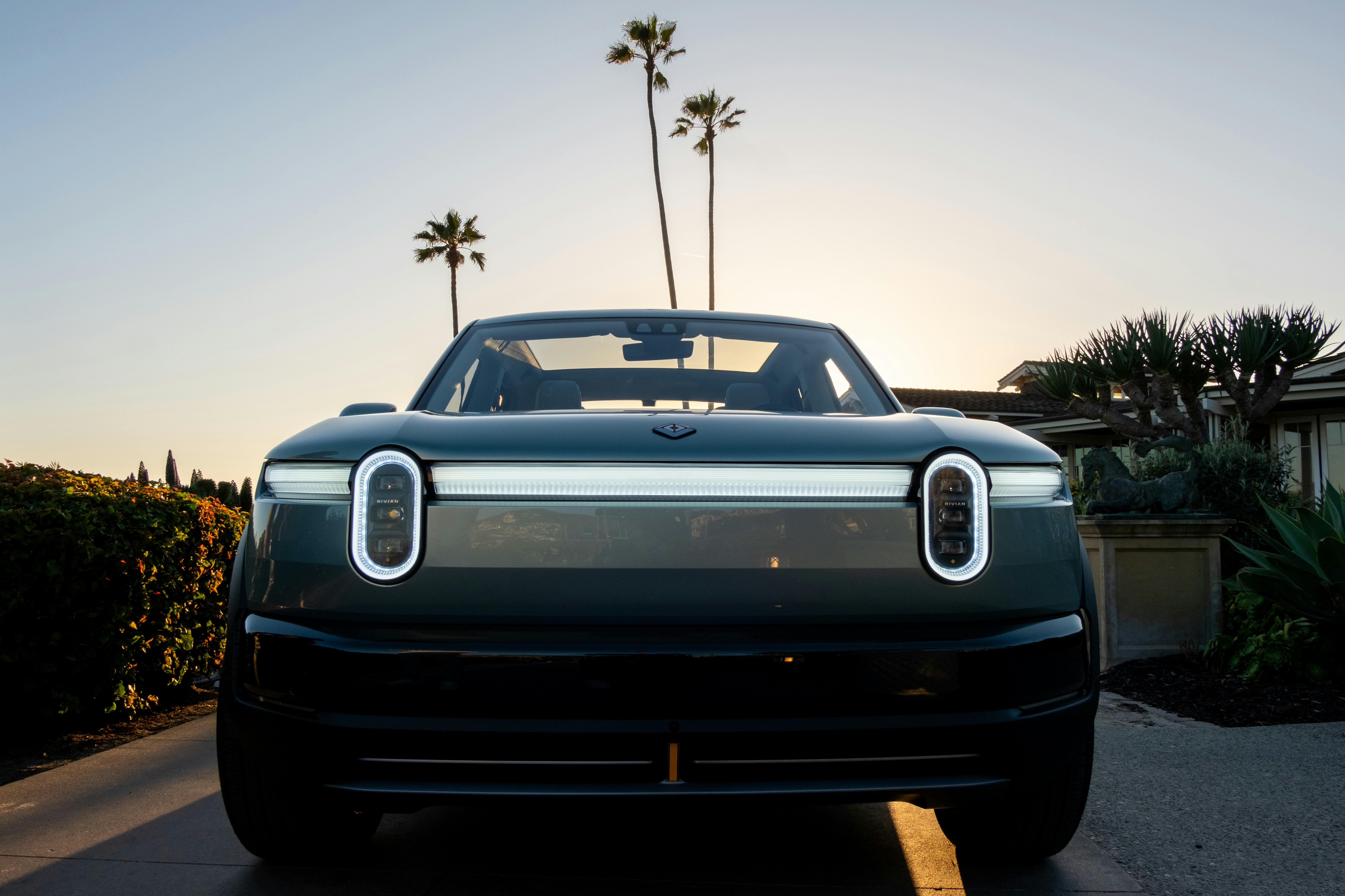 Rivian electric SUV displayed during a product launch event highlighting the upcoming R2 platform aimed at the mass-market EV segment.