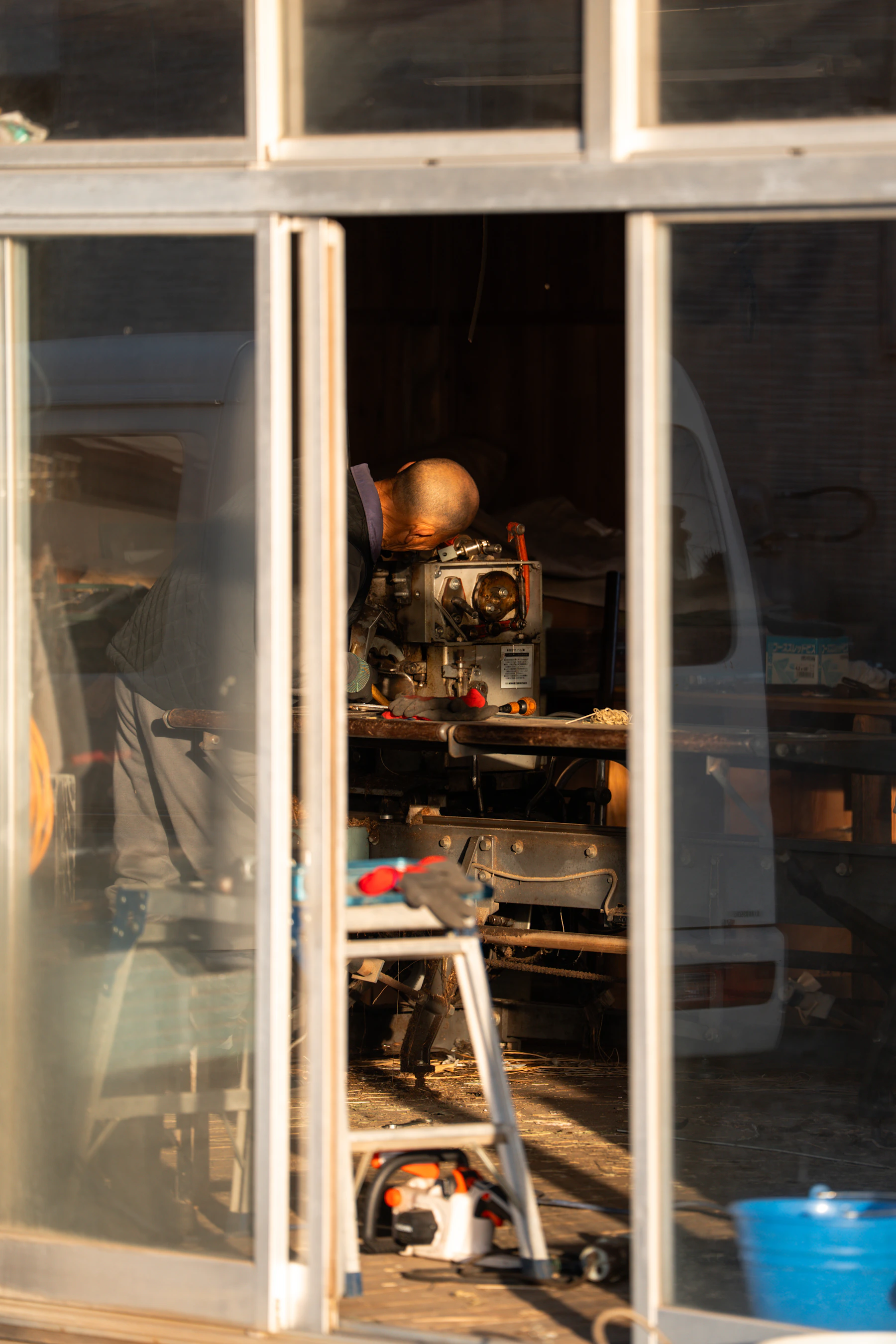 Craftsman working with tools inside a practical garage workshop