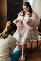 Young woman with down syndrome trying on a dress