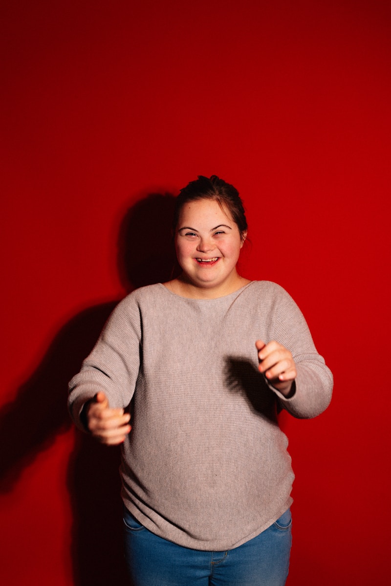 Young woman with Down syndrome smiling and laughing