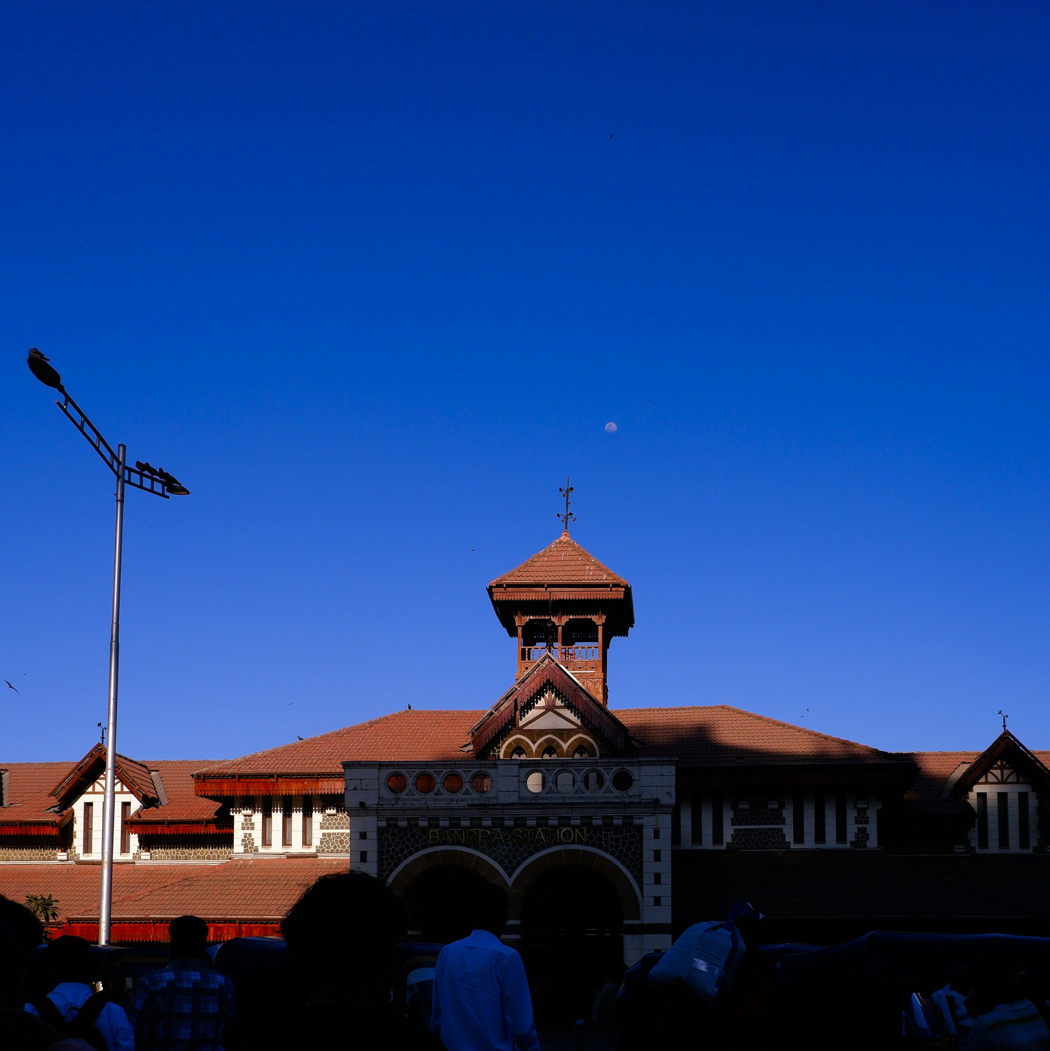 Historic building with a tower against a clear blue sky