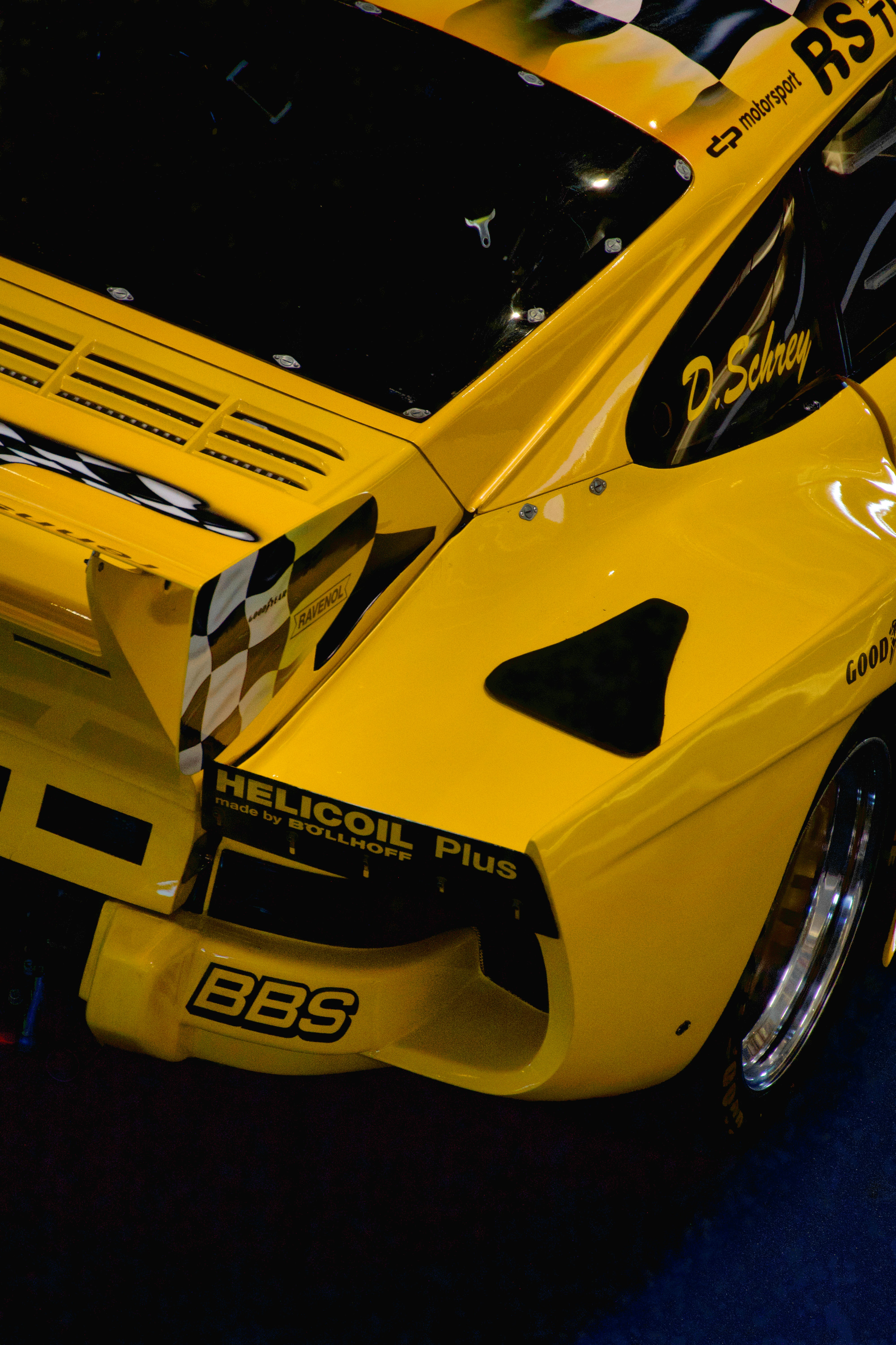 Yellow race car with sponsor logos and spoiler photo – Free Sports car ...