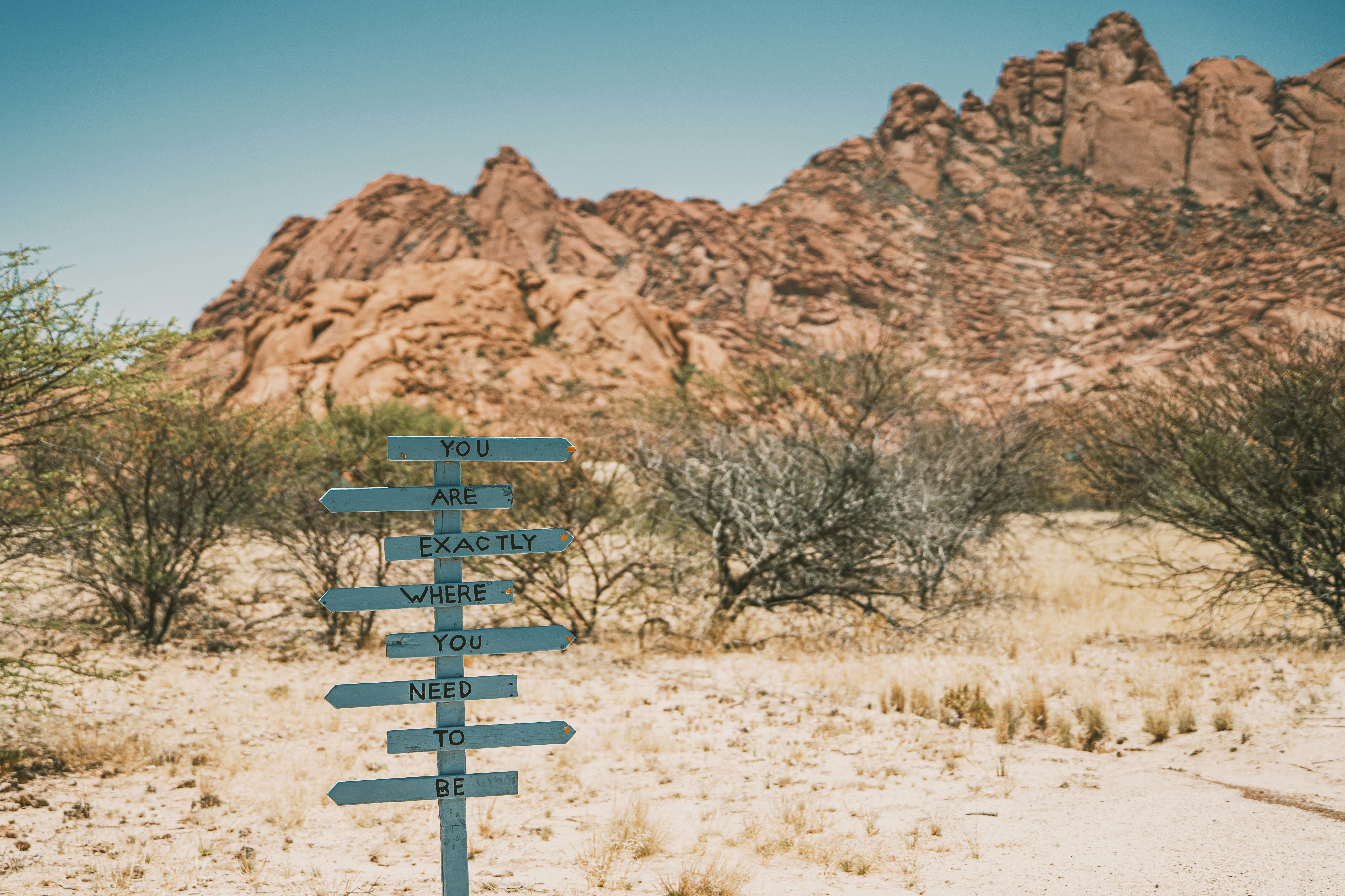 Signpost in a desert landscape with mountains photo – Free Mountains ...