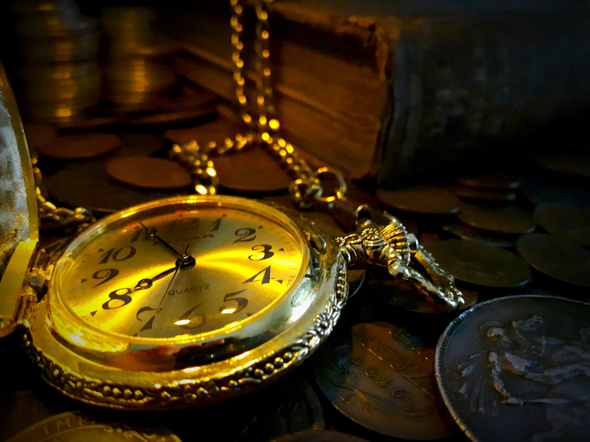Antique pocket watch, old coins, and collector books