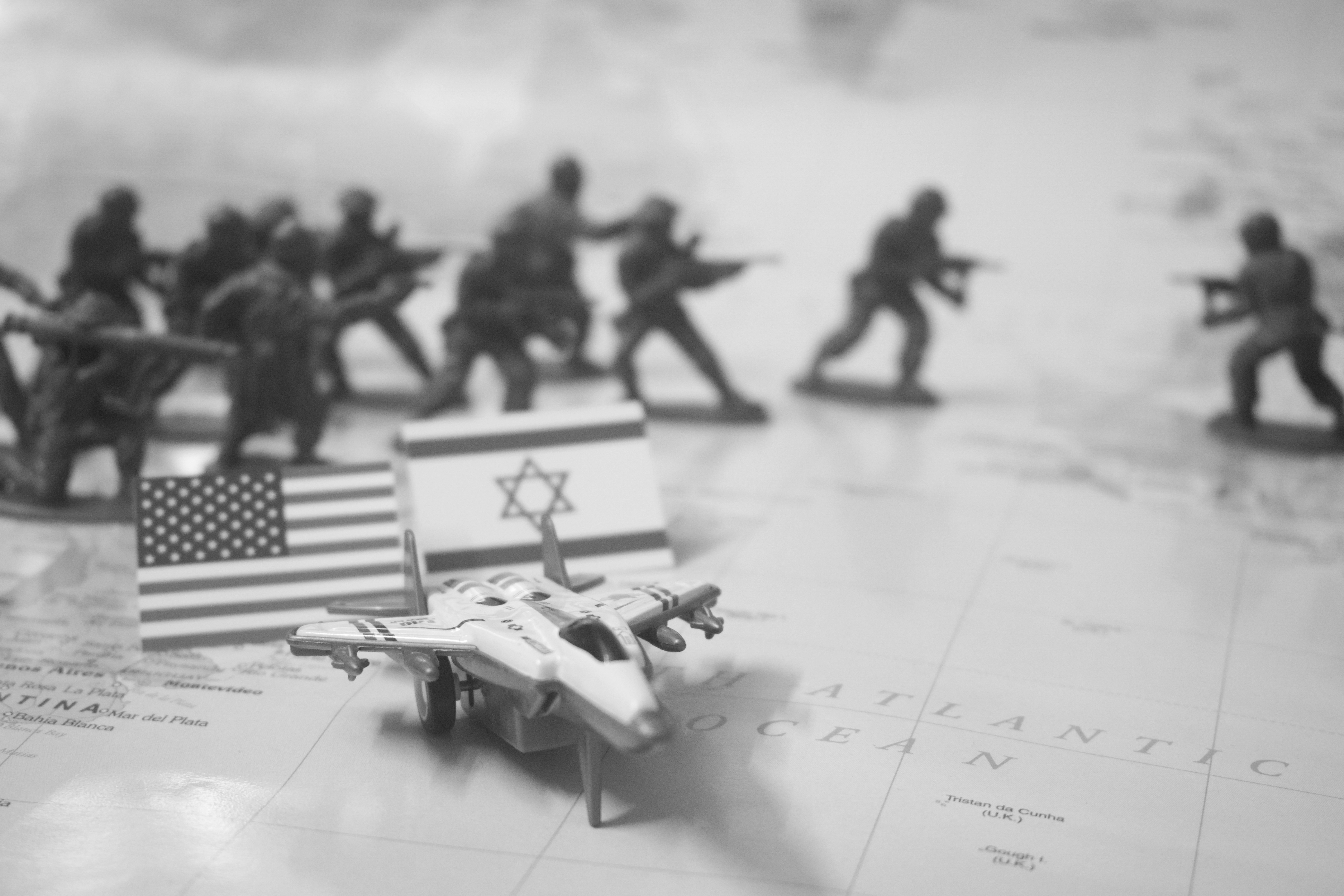 Toy soldiers, flags, and jet on map