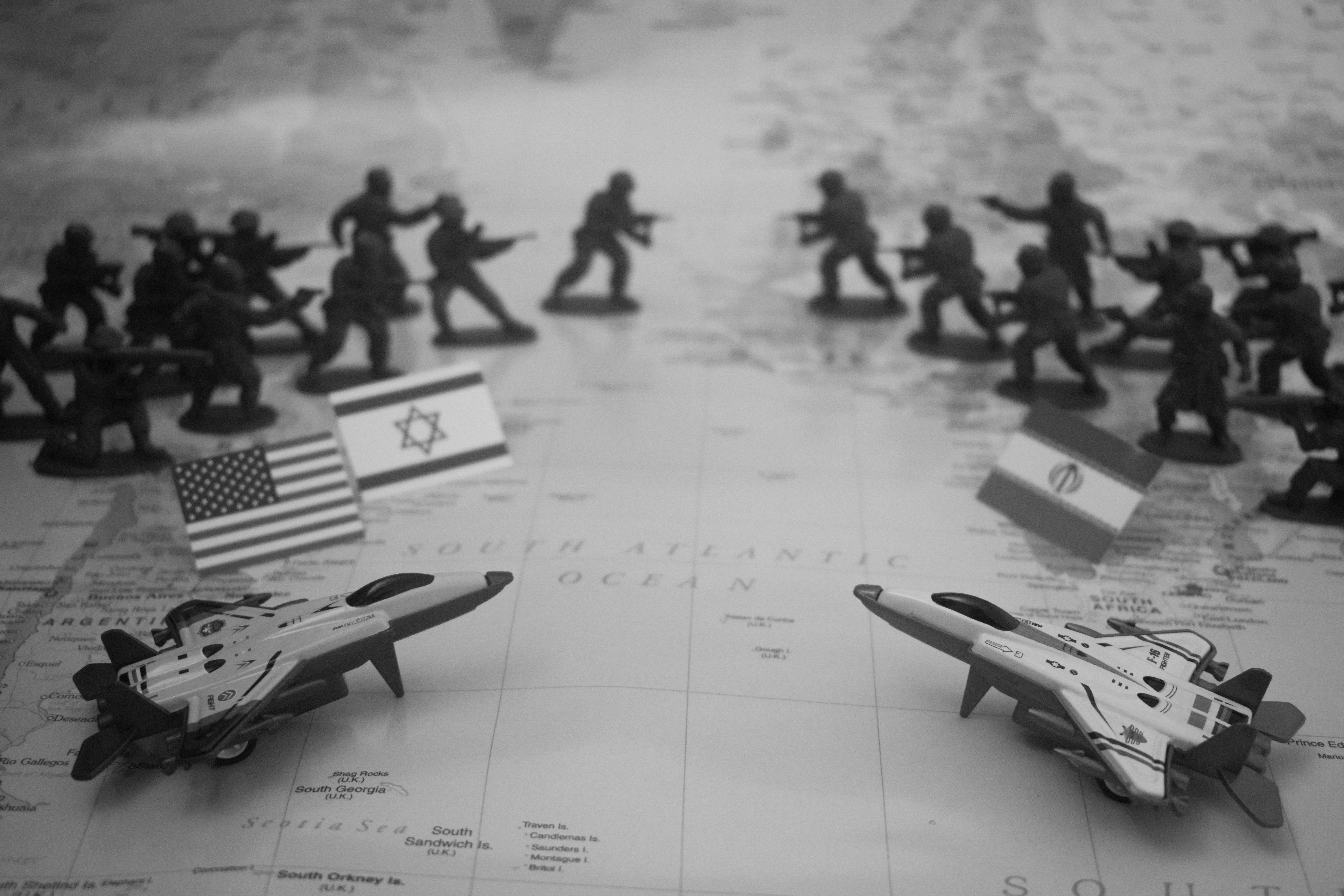 Toy soldiers and fighter jets arranged on a map.
