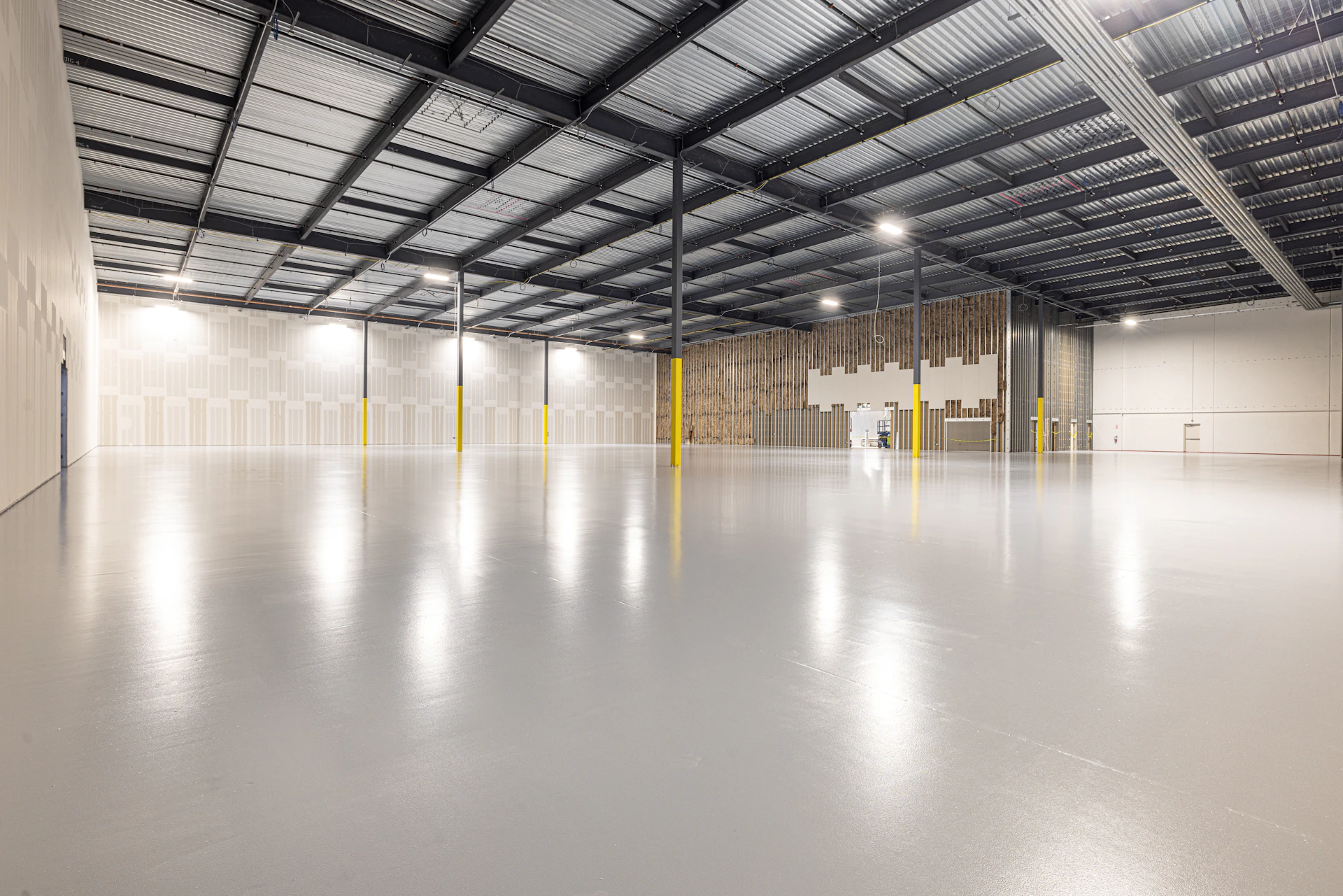 Empty industrial warehouse with polished concrete floor