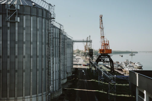 Industrial silos and cranes at a port