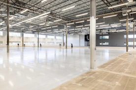 Empty, modern warehouse interior with polished concrete floor.