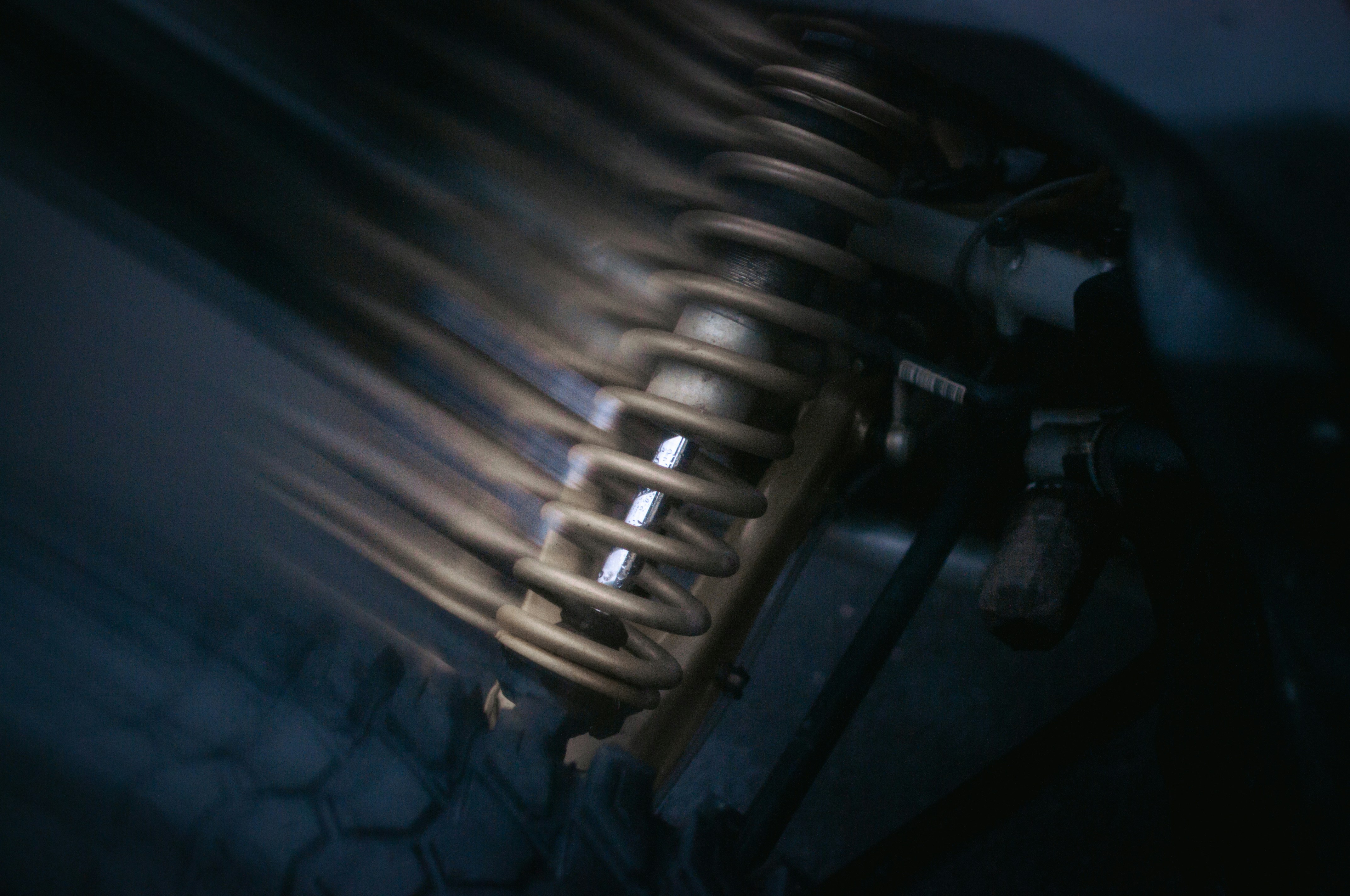 Close-up of a metal spring mechanism with blurred motion.