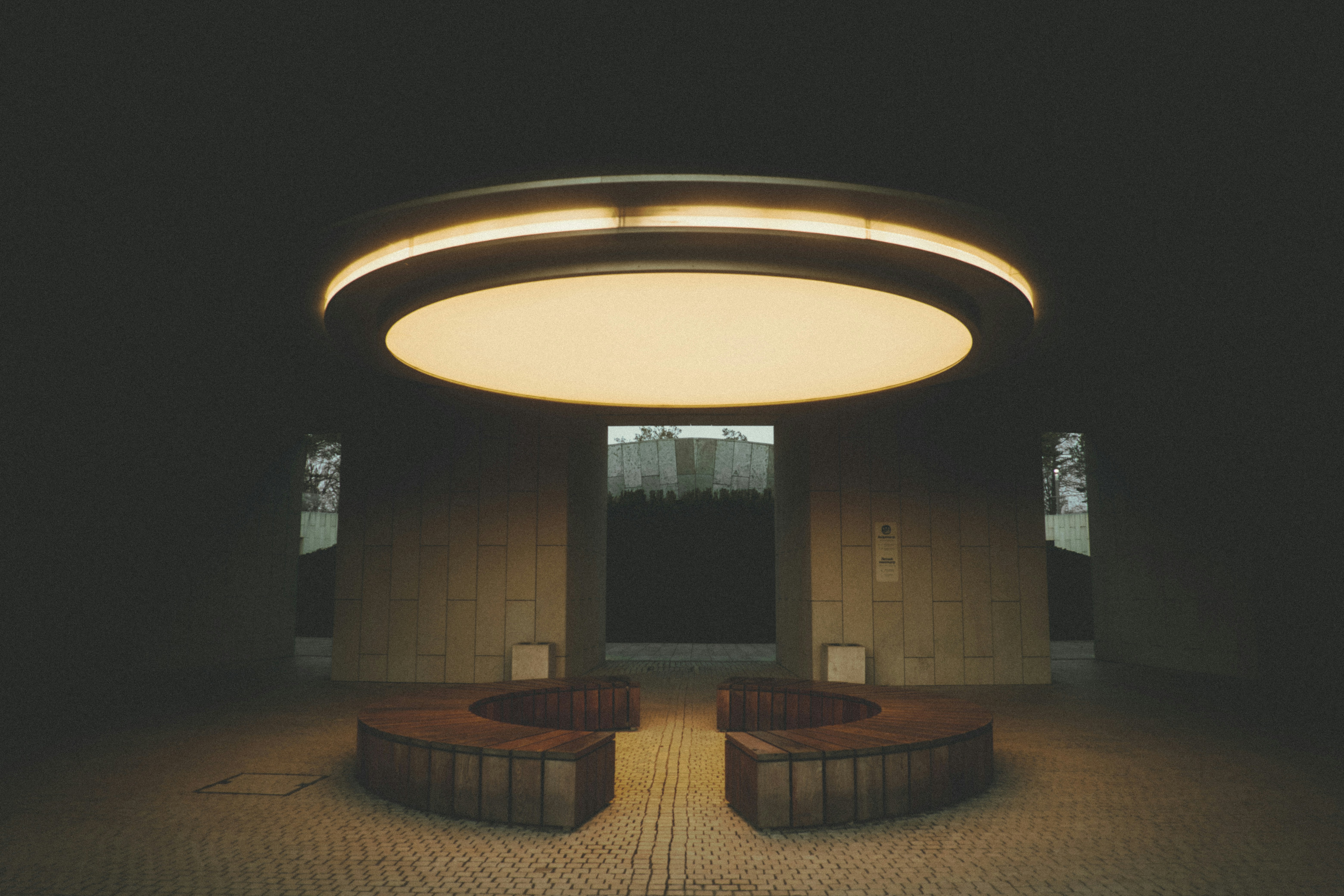 Modern circular seating area with overhead light