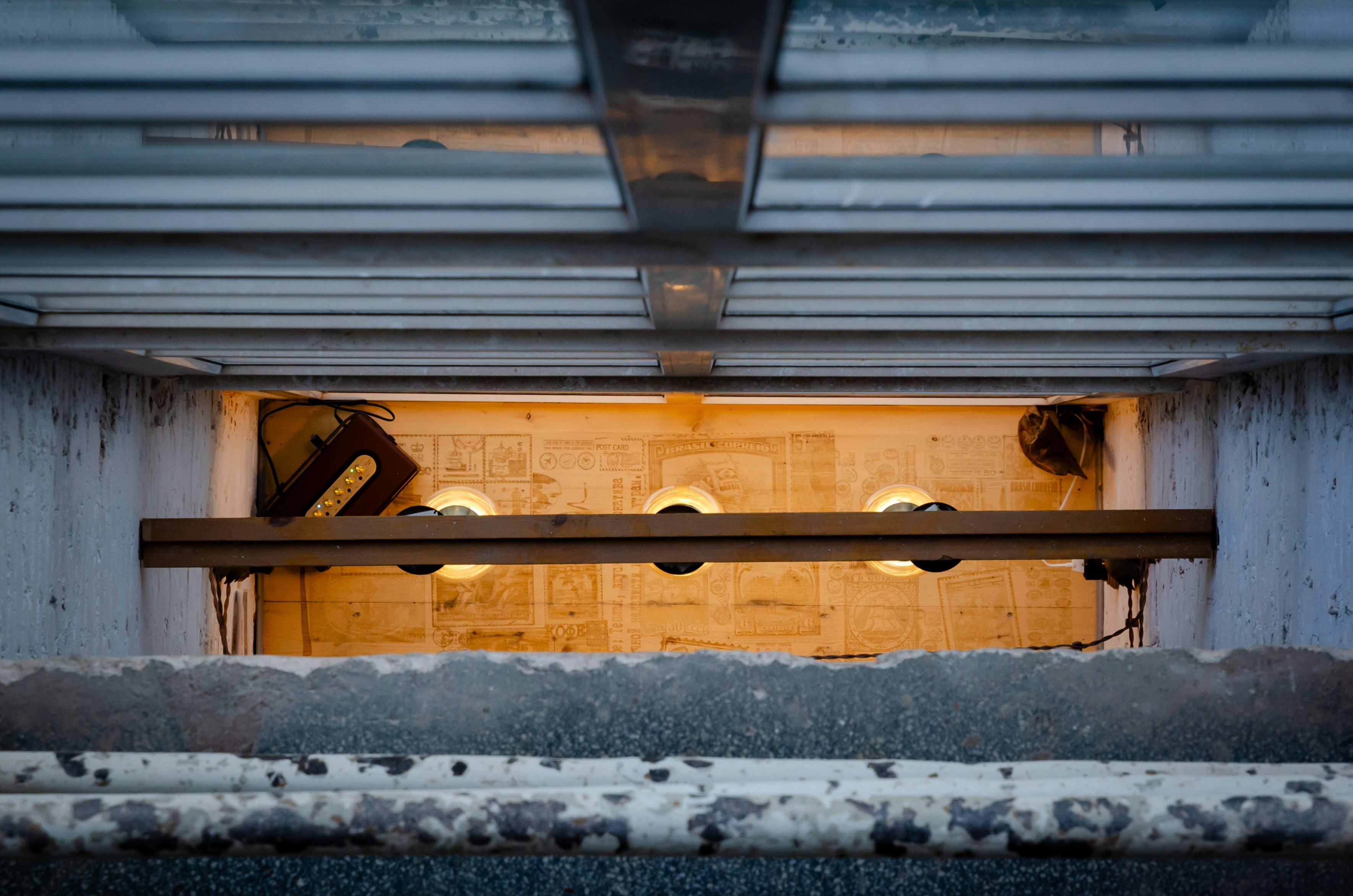 Looking down into a dimly lit industrial space