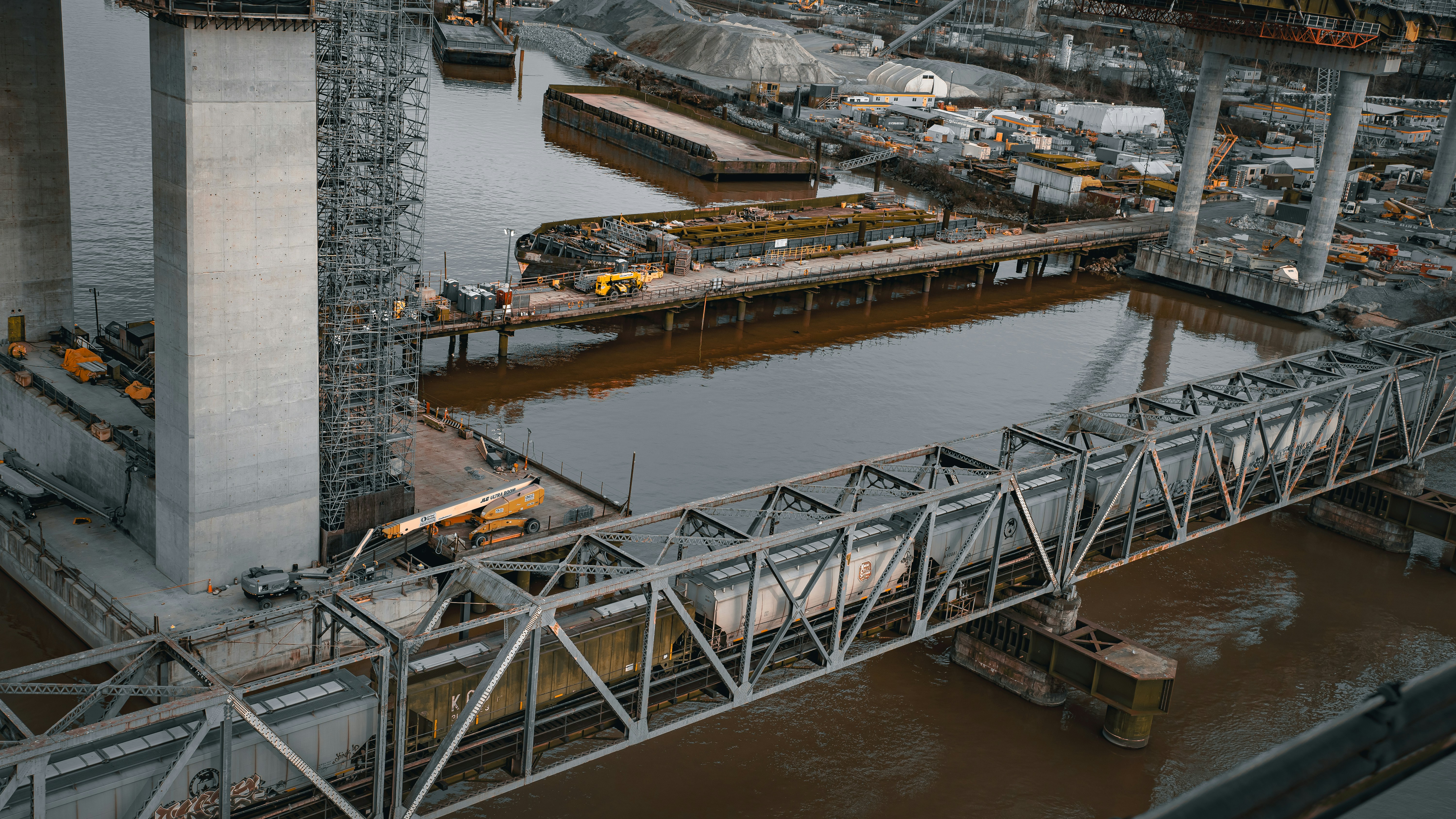 Construction of a bridge over a body of water.