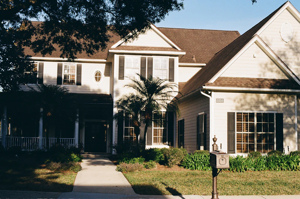 Suburban house behind a hedge