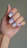 Woman's hand with blue and white ombre nails
