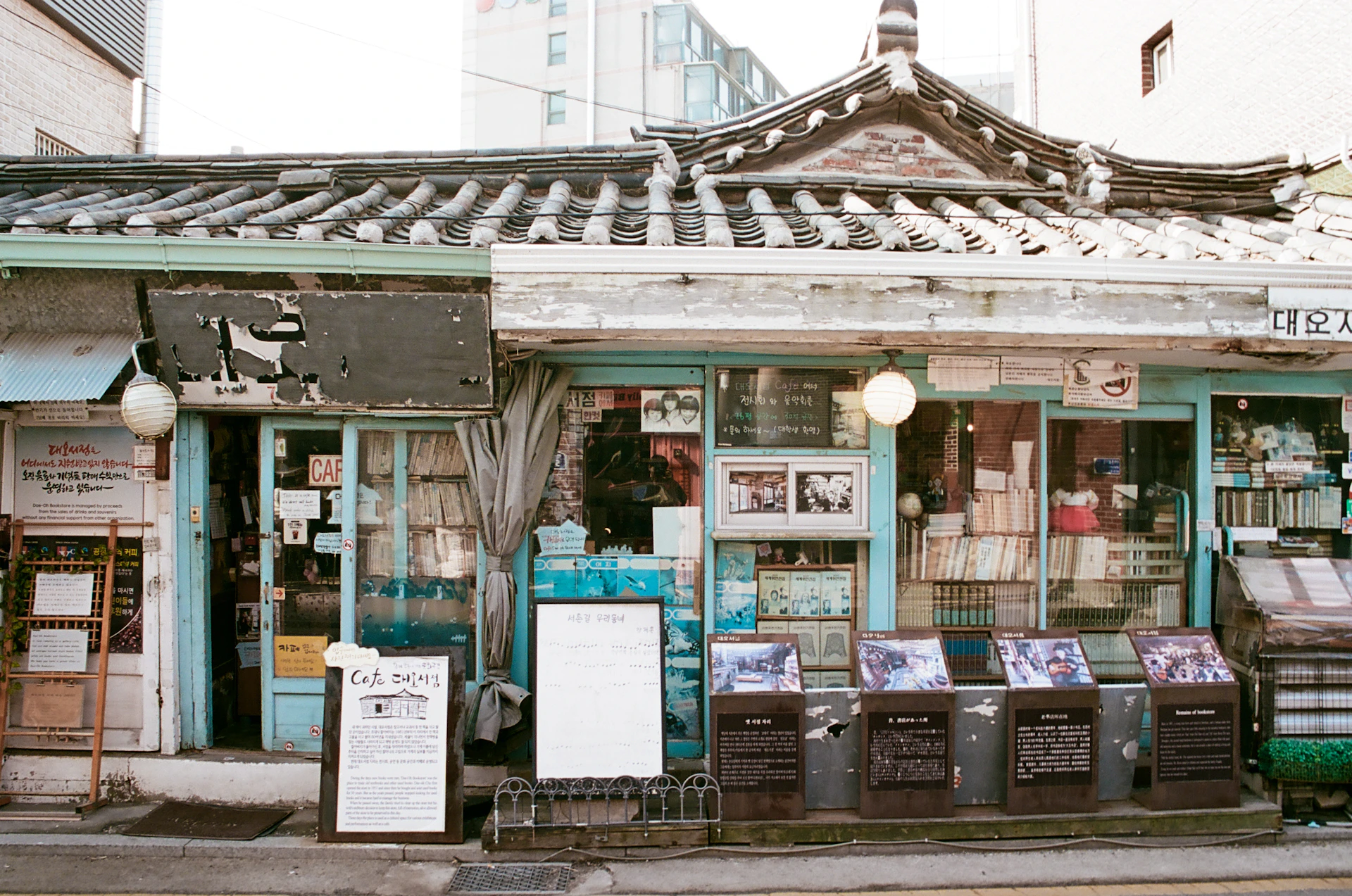 Traditional korean storefront with displays of goods.