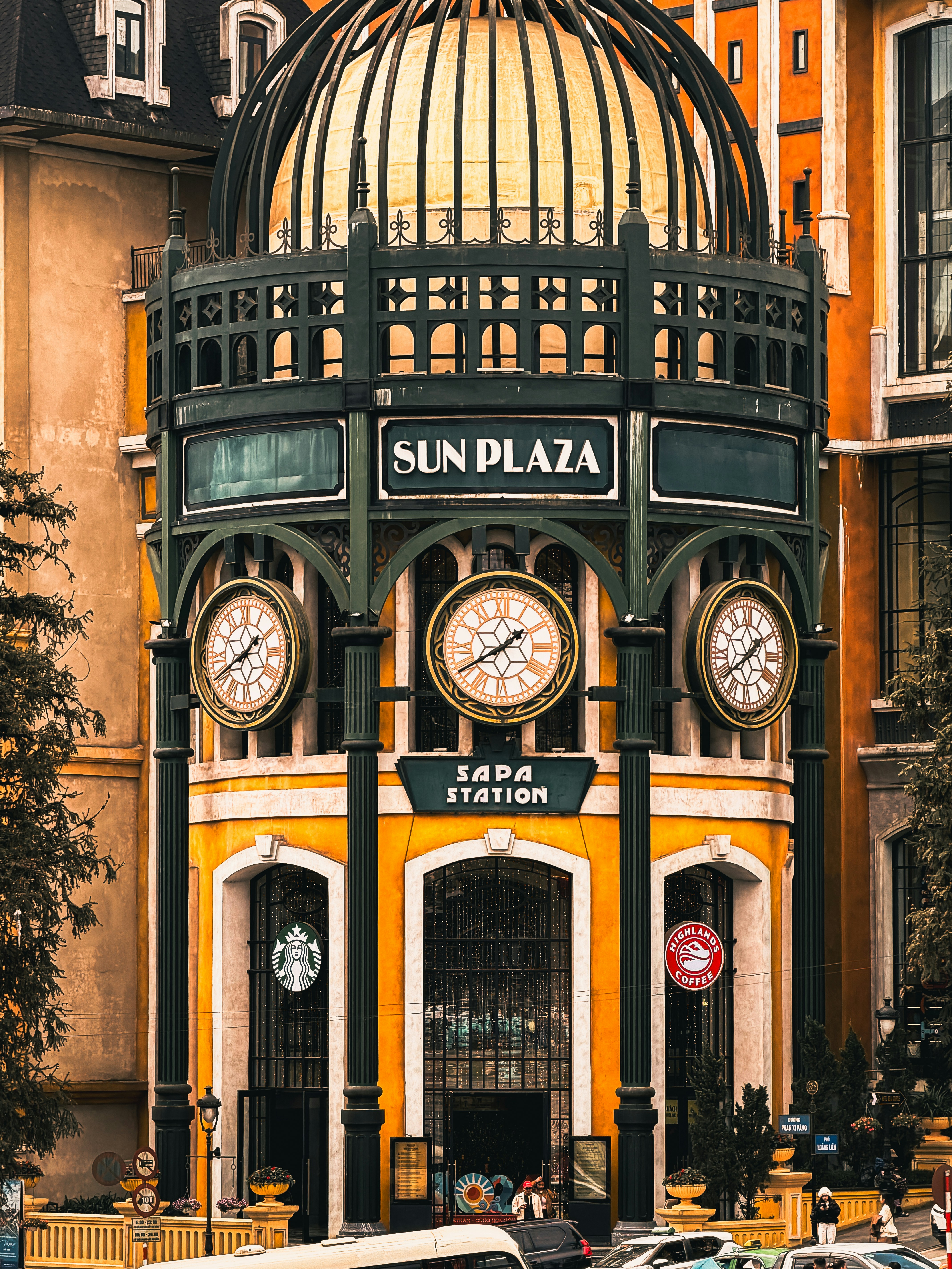 Sun plaza station with three clocks and dome