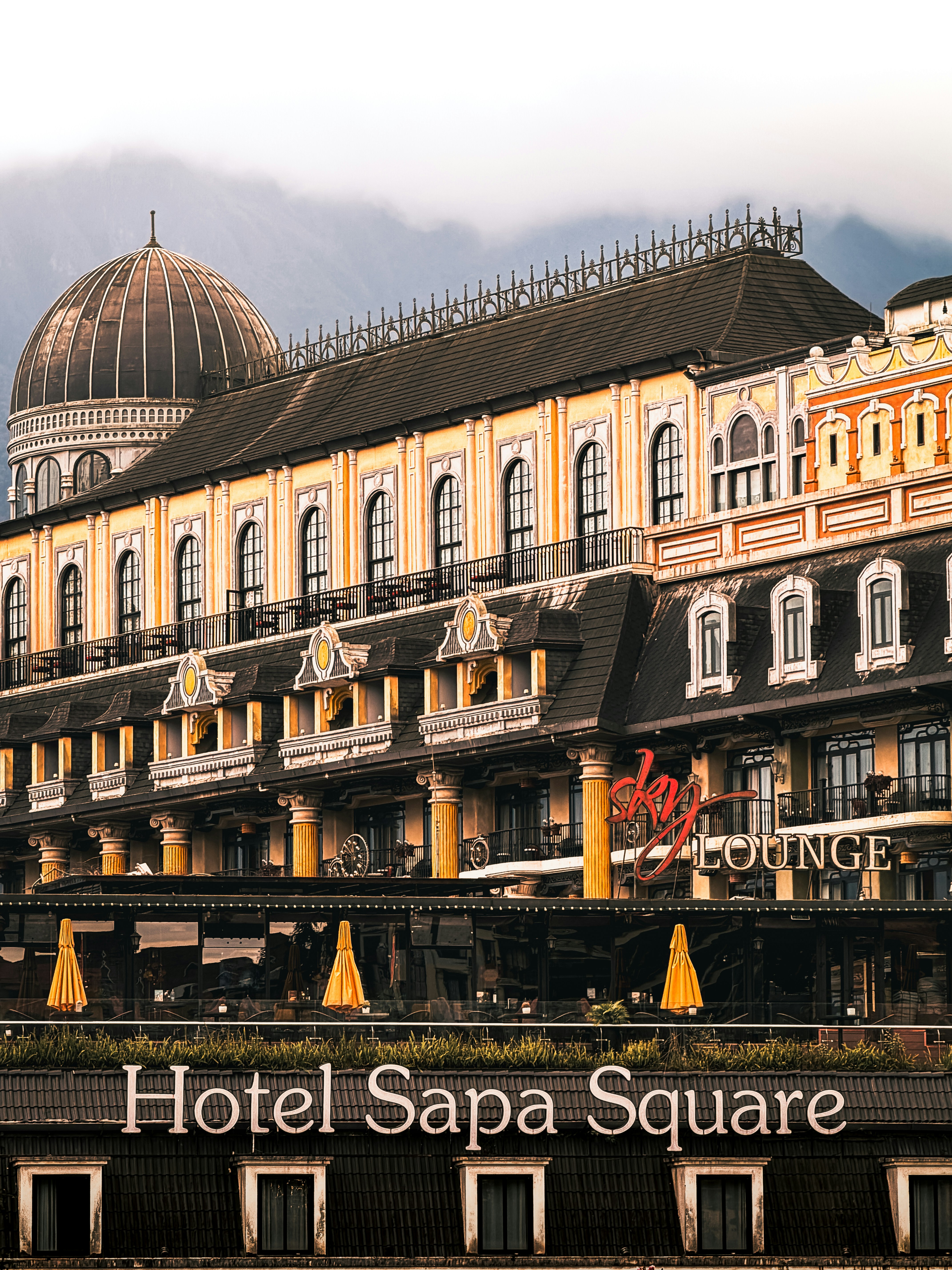 Hotel sapa square with ornate architecture and classic architecture.