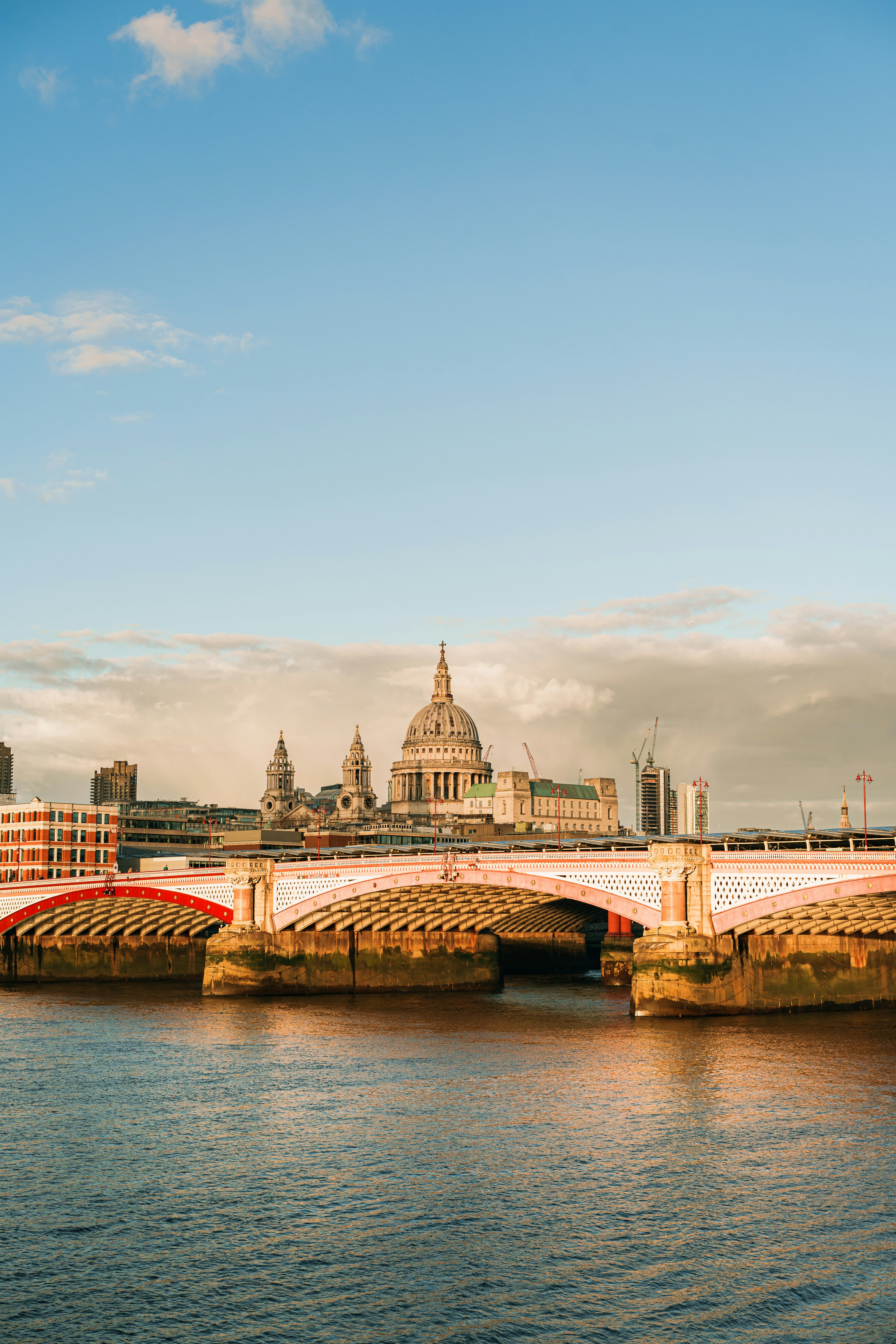 St. paul's cathedral and millennium bridge over river thames.