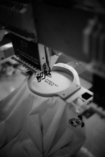 Embroidery machine stitching design onto fabric