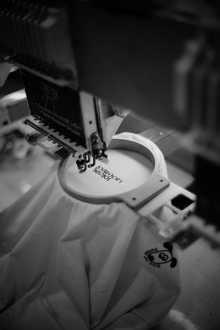 Embroidery machine stitching a design onto fabric