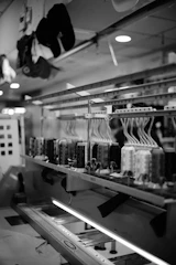 Industrial embroidery machine with multiple spools of thread