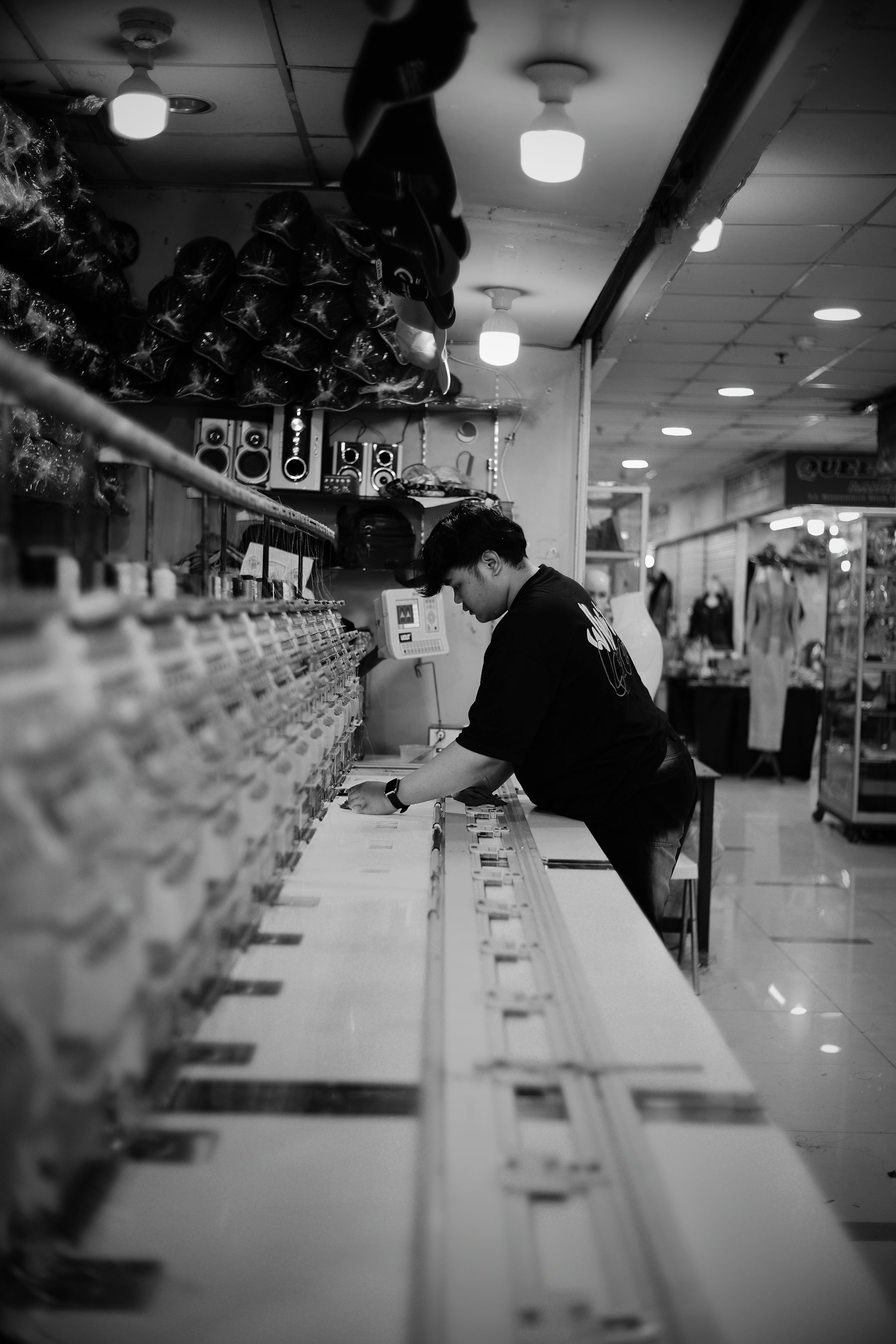 Man working at a sewing machine in a factory