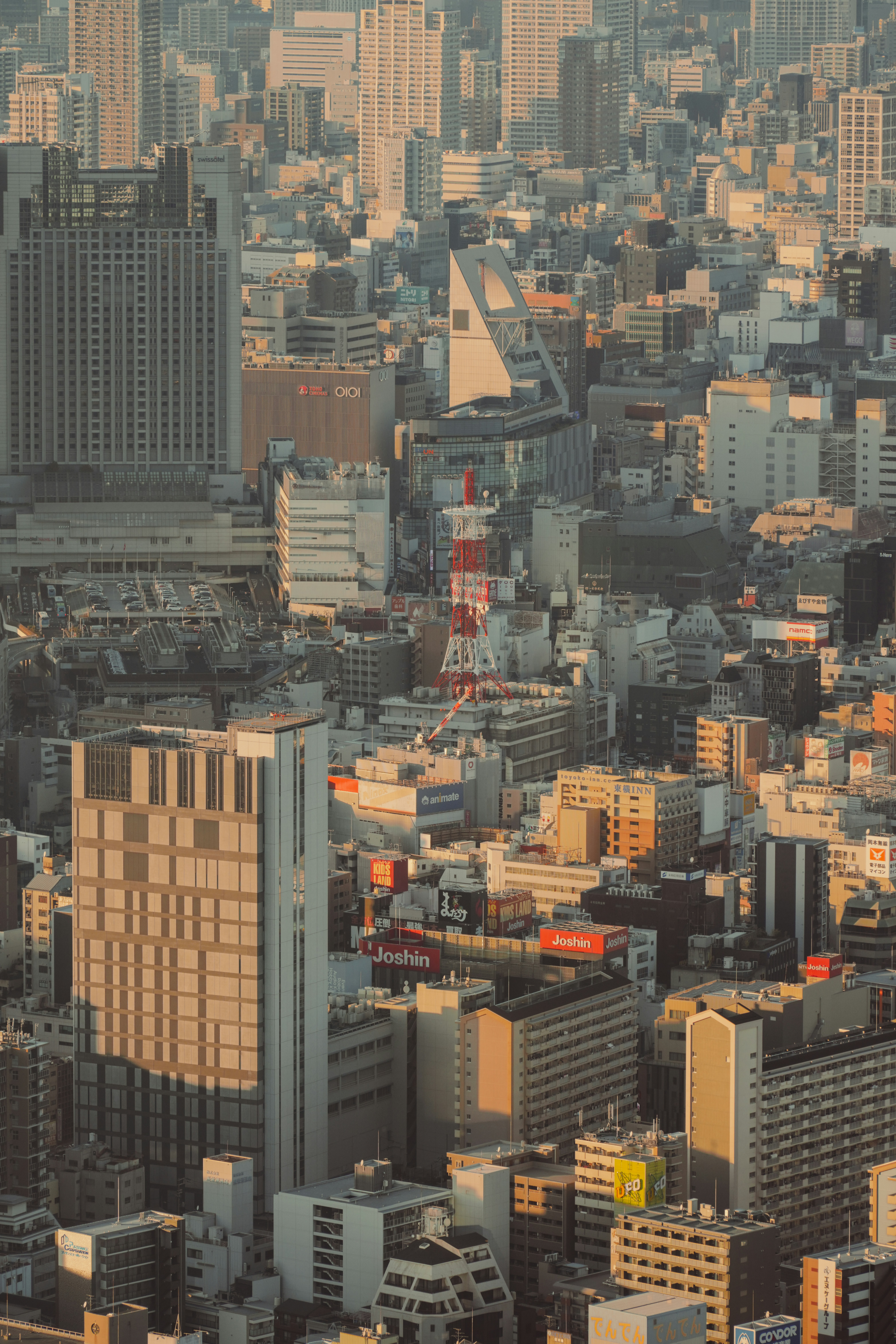 Aerial view of a dense cityscape with tall buildings.