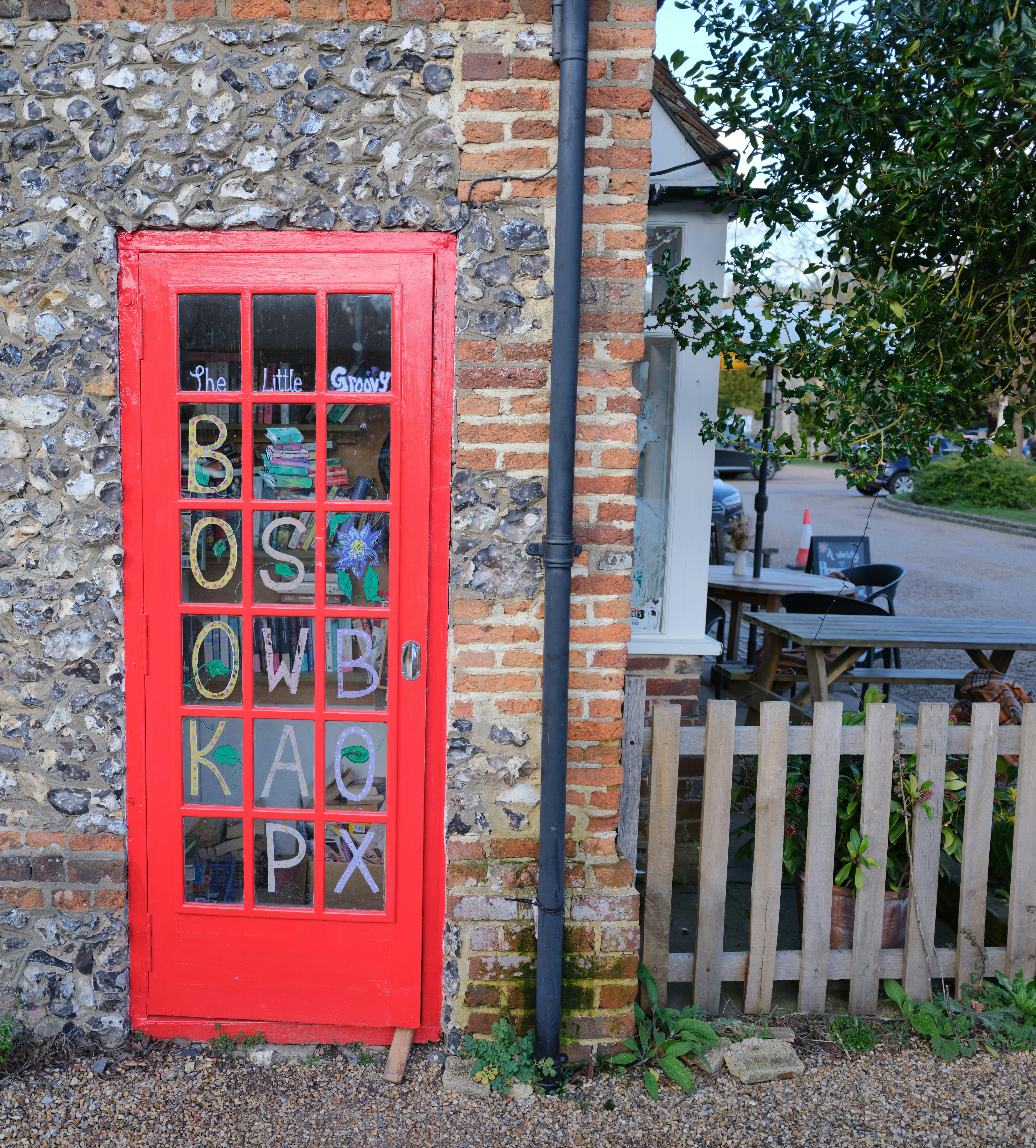 Red telephone box converted into a book exchange.