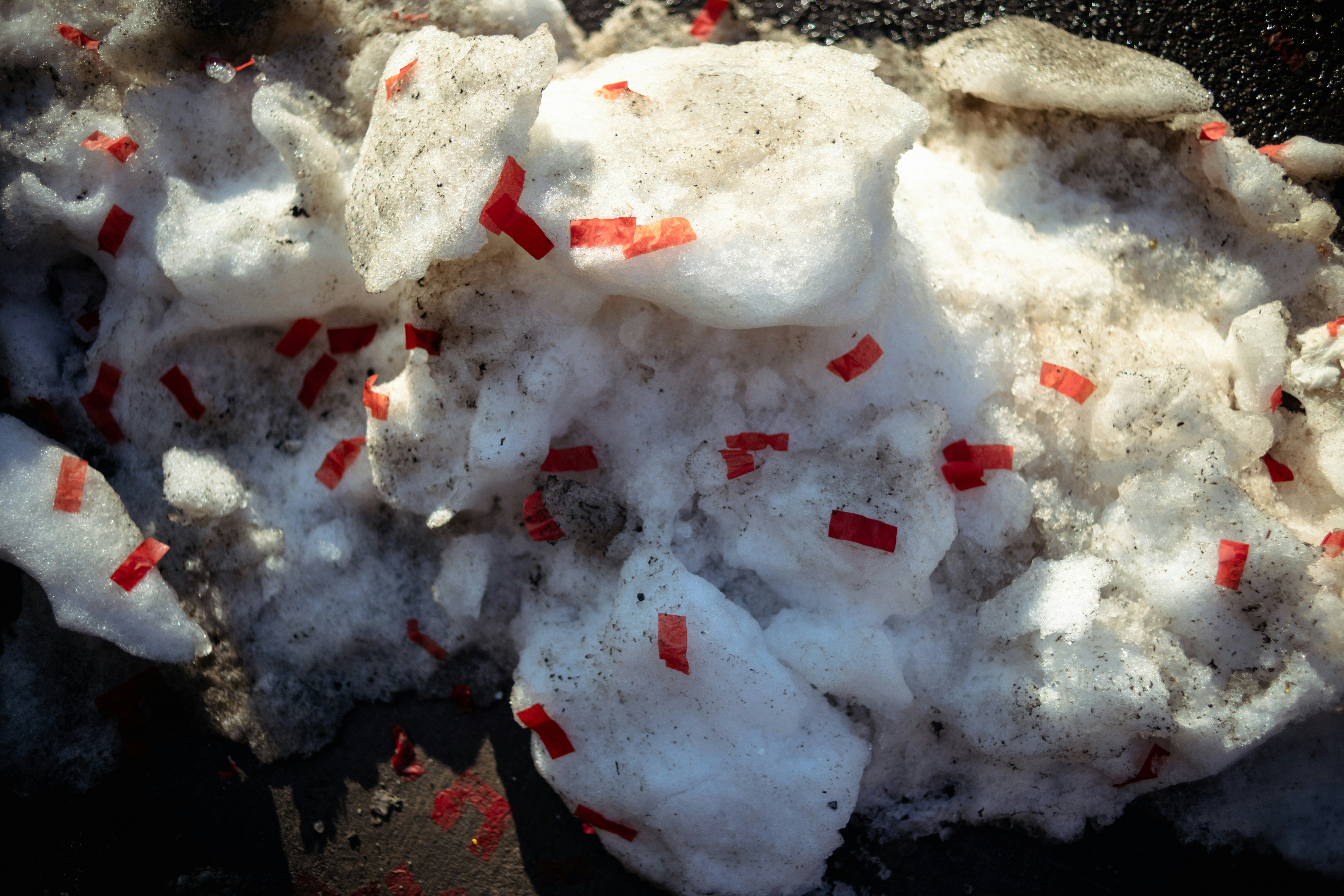 Snow with small red pieces scattered throughout
