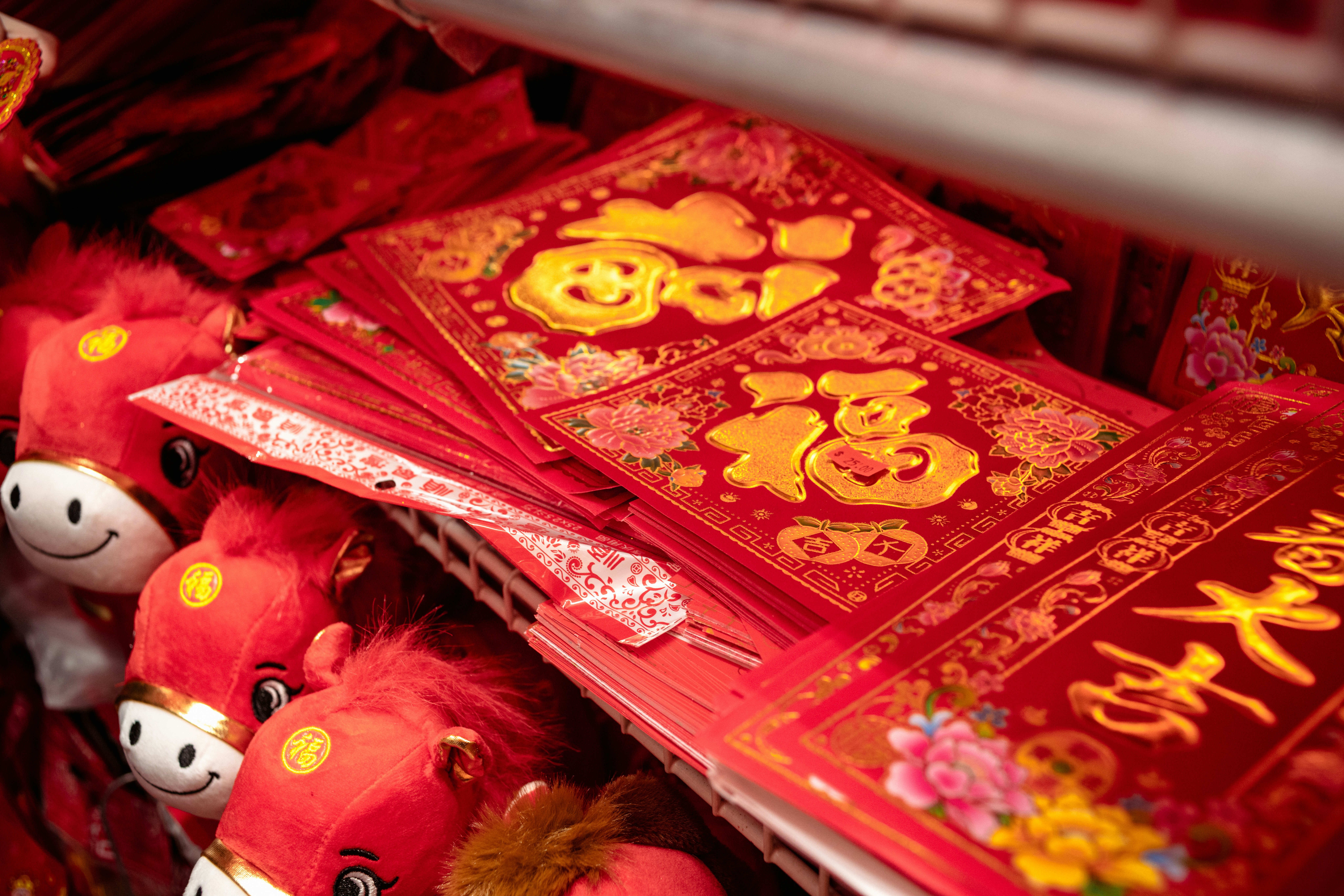 Red envelopes and horse toys for chinese new year.