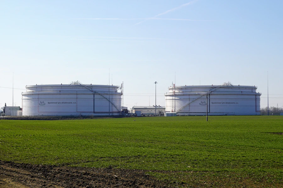 Large white storage tanks at an industrial tank farm