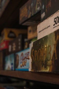 Rows of board game boxes on a shelf