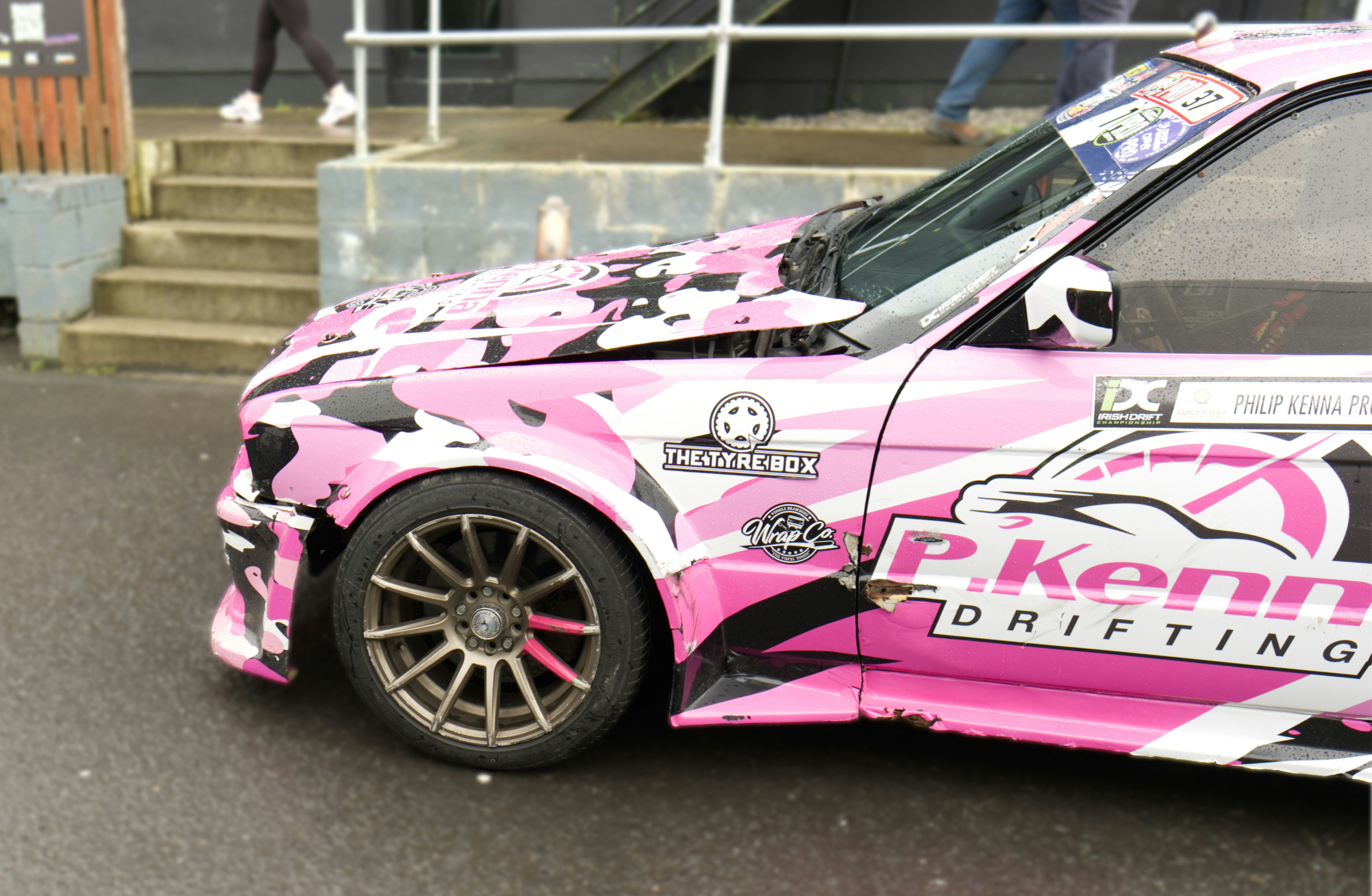 Pink drift car with racing decals on its side