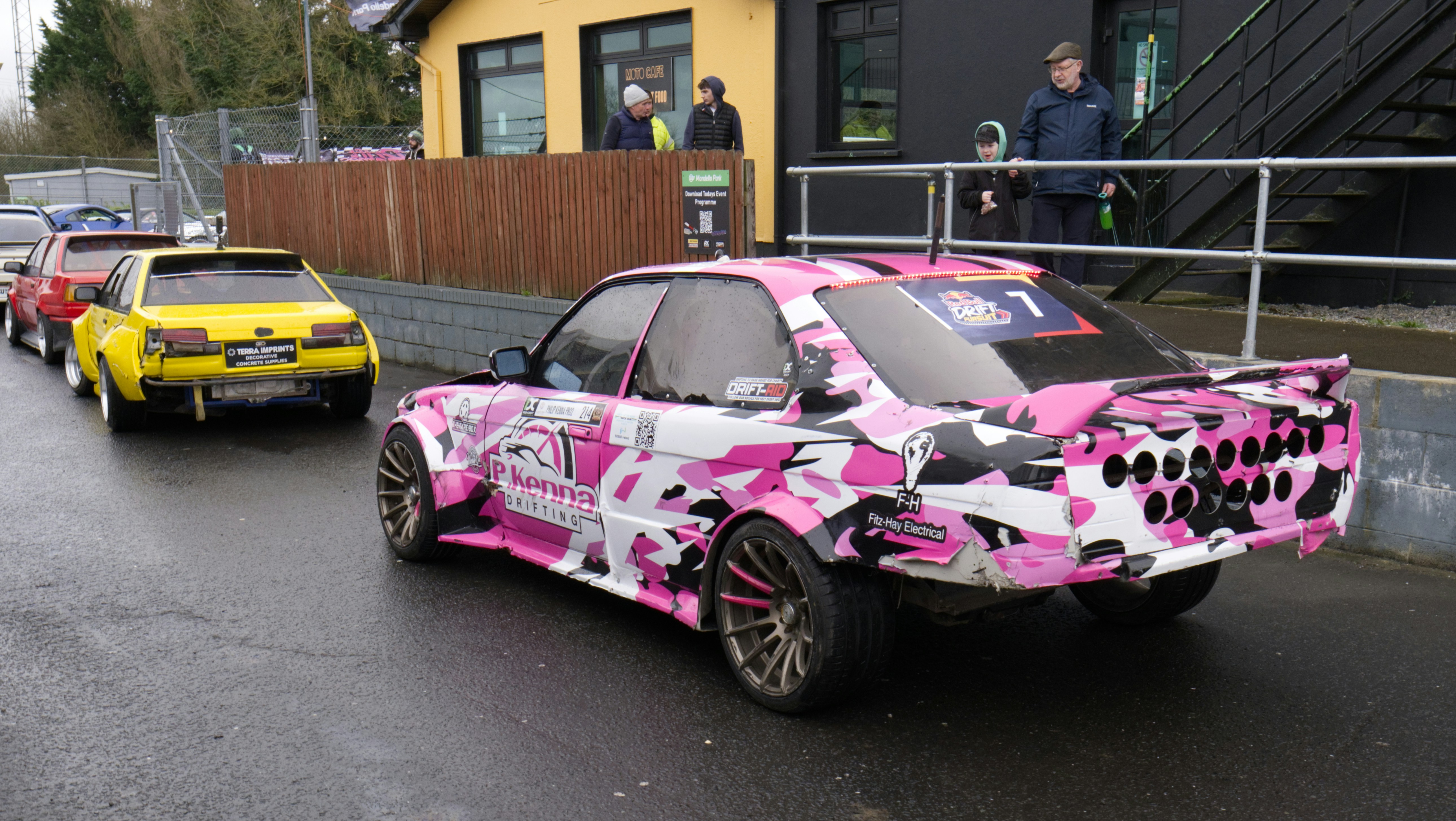 Drift car with pink camouflage design parked