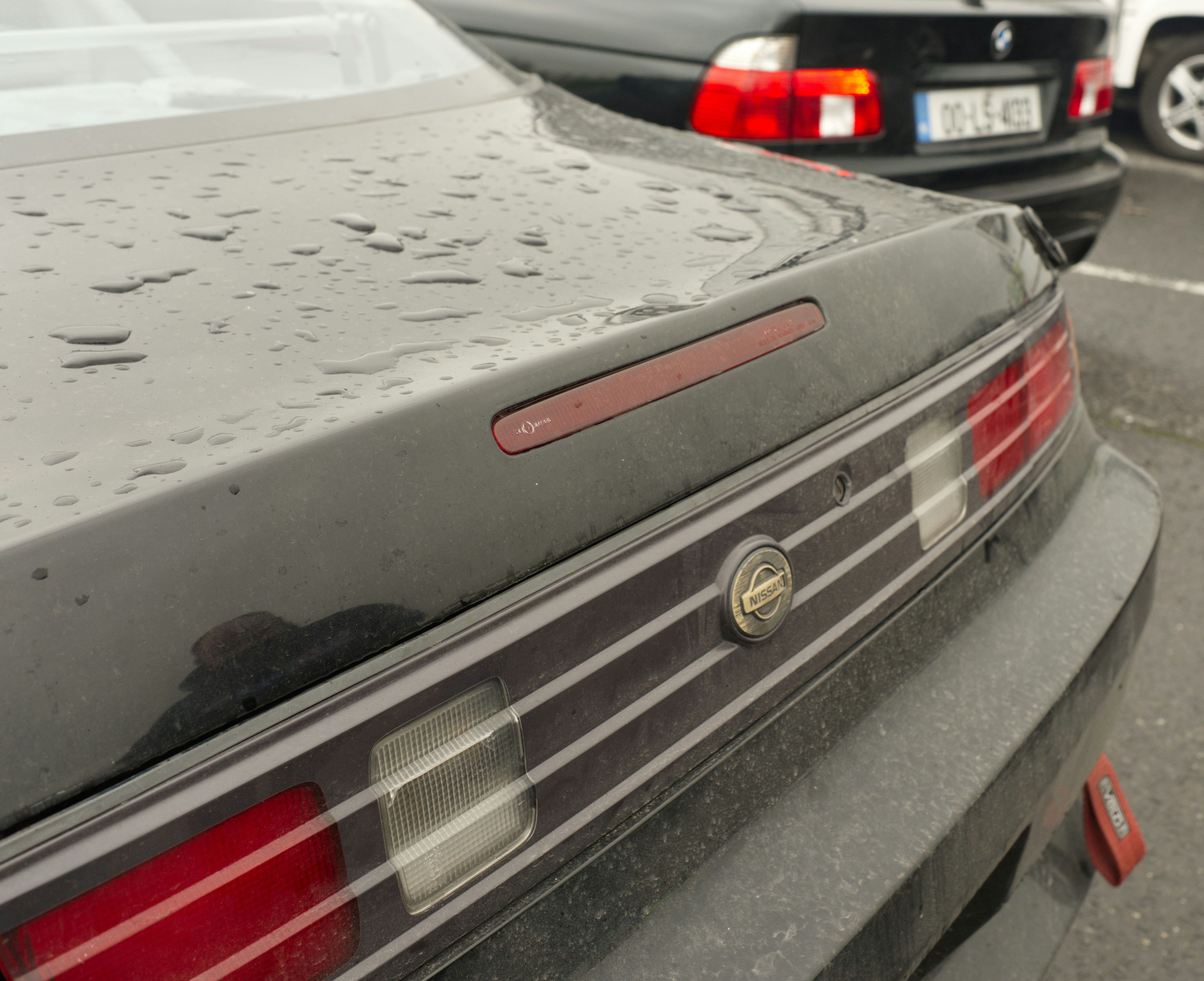 Close-up of a dark car's rear