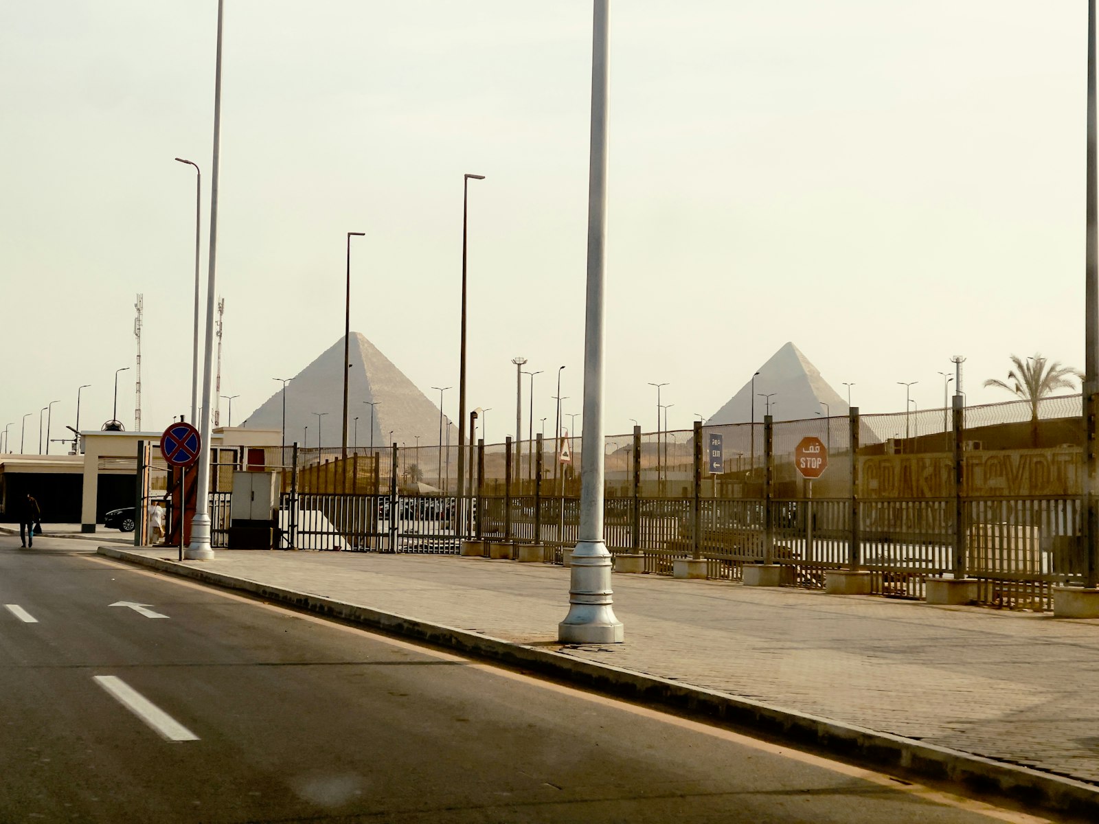 Pyramids seen from a desert road on the way into Cairo
