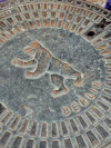 Berlin manhole cover with a bear emblem