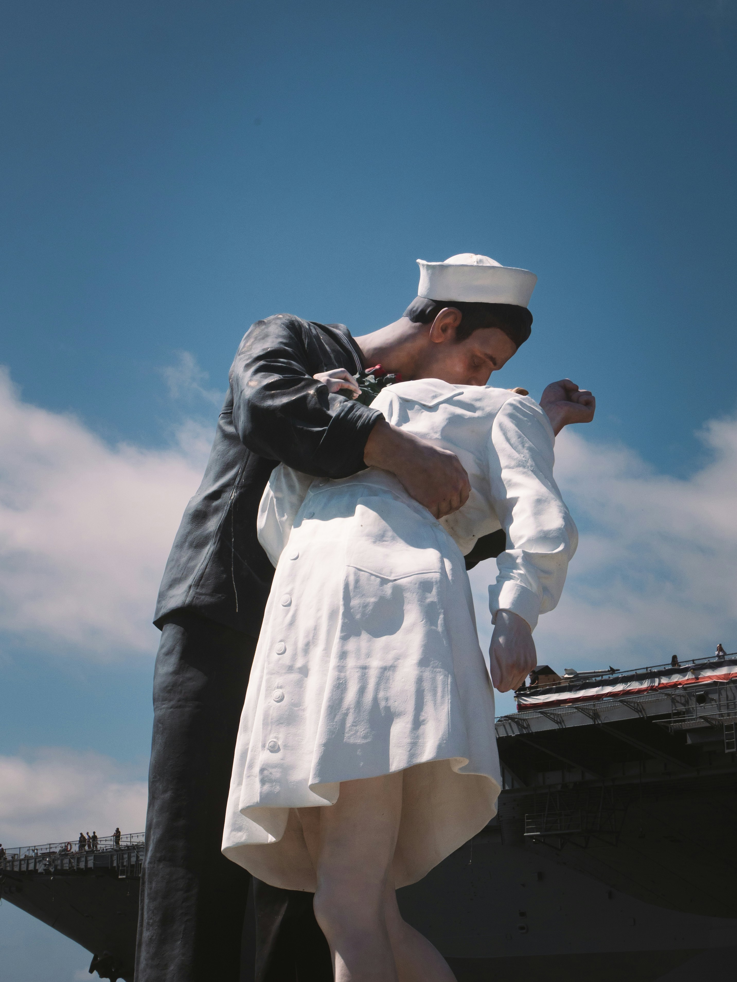 Sailor kissing nurse on a sunny day