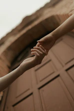 Two hands reaching for each other