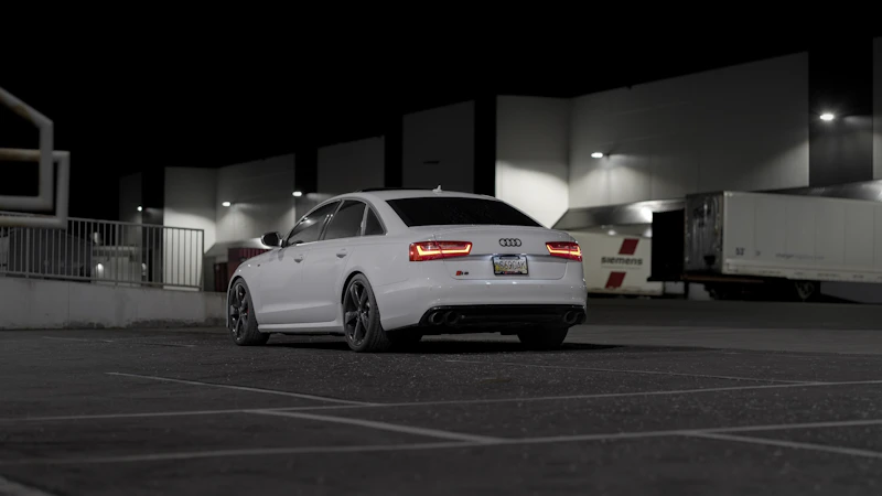 Luxury sedan in a New Zealand parking lot