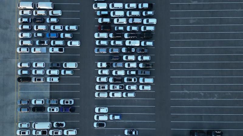 Aerial view of a full parking lot packed with vehicles