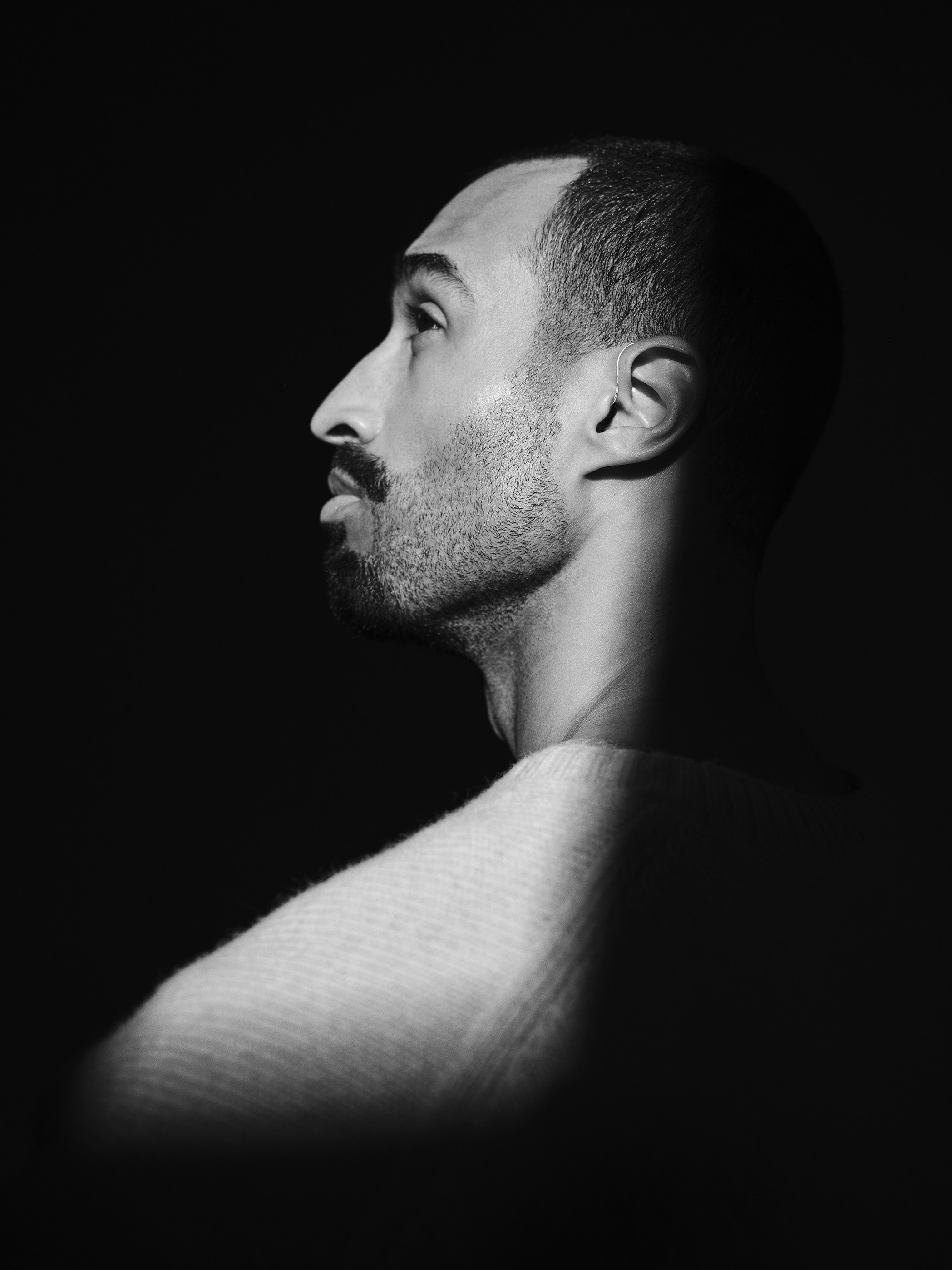 Man's profile illuminated by dramatic light