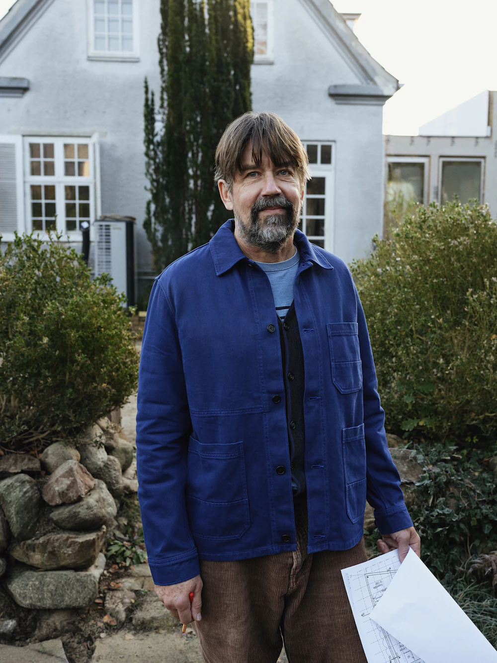 First-time buyer standing in front of a home