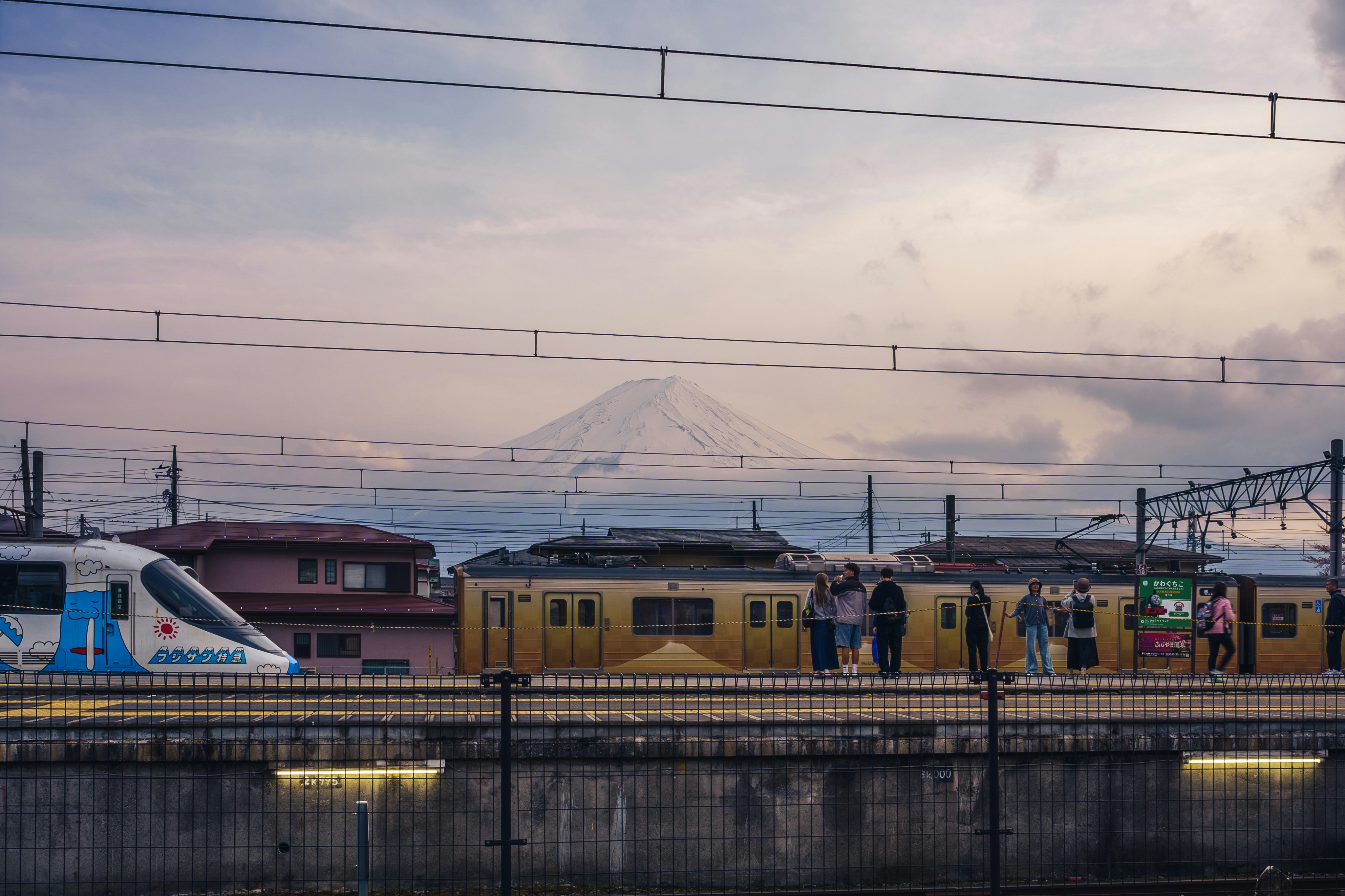 Train station with mount fuji in the background.