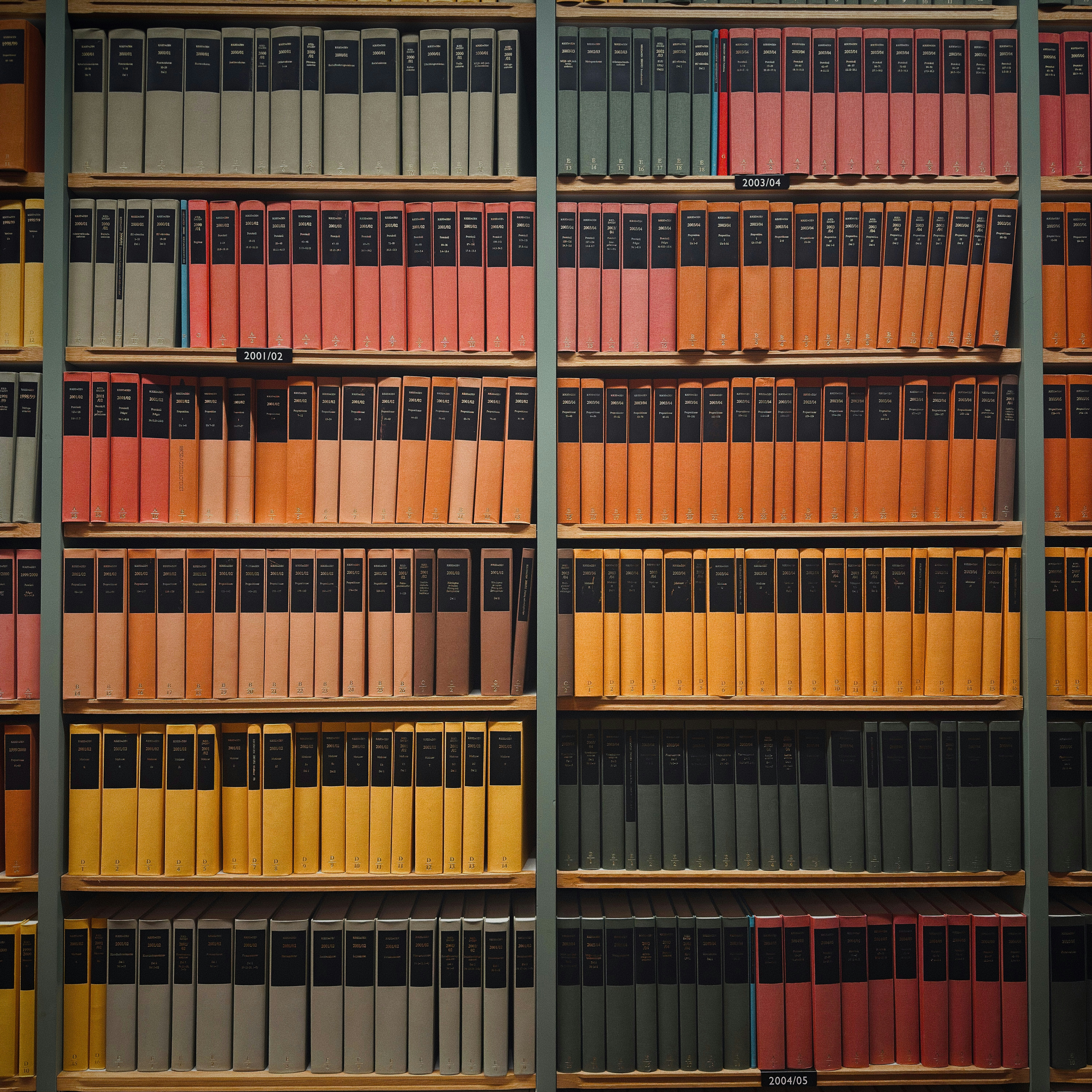 Rows of colorful books on library shelves