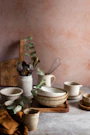Various ceramic bowls and kitchen utensils arranged decoratively.