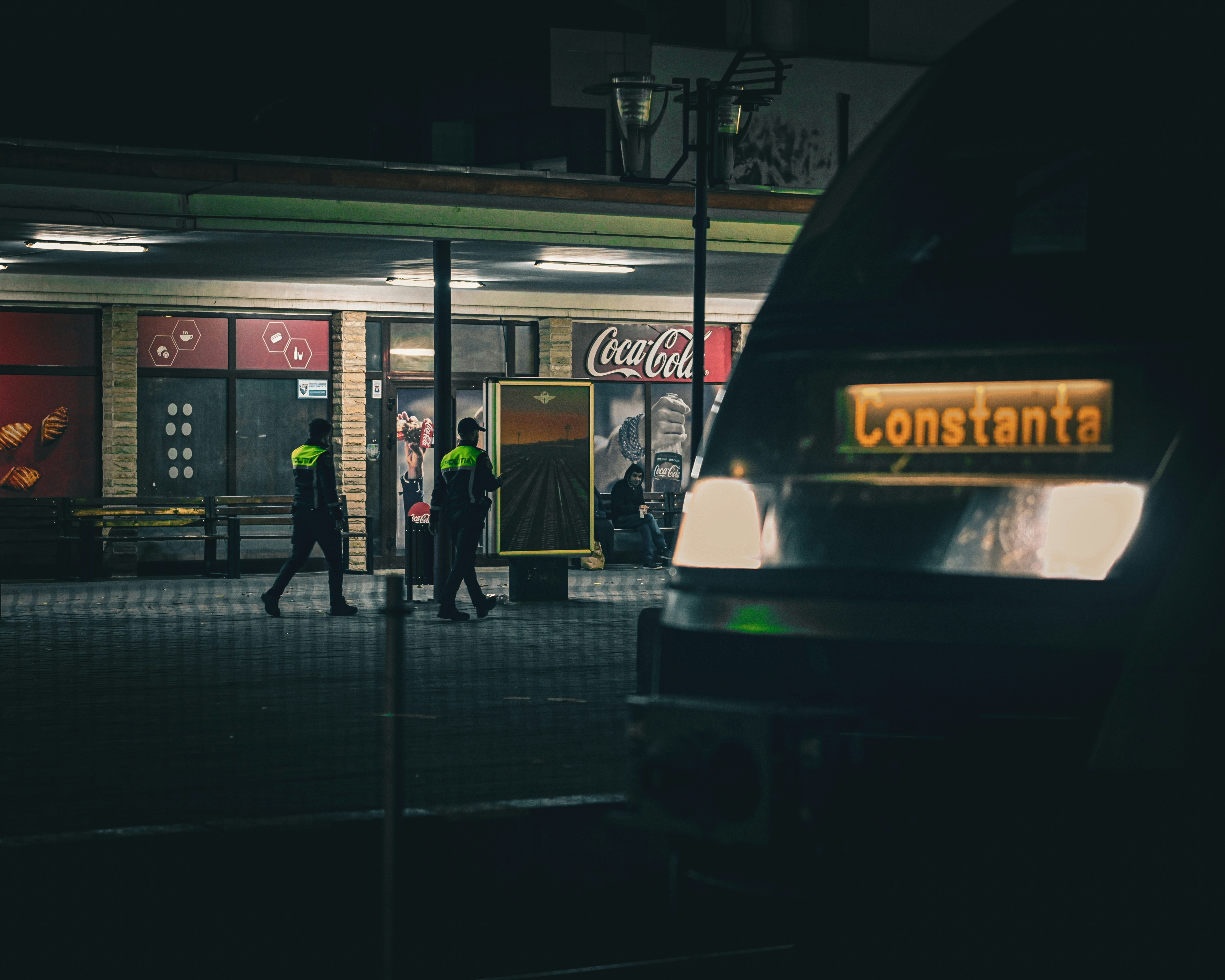 Train destination sign reads constanta at night.