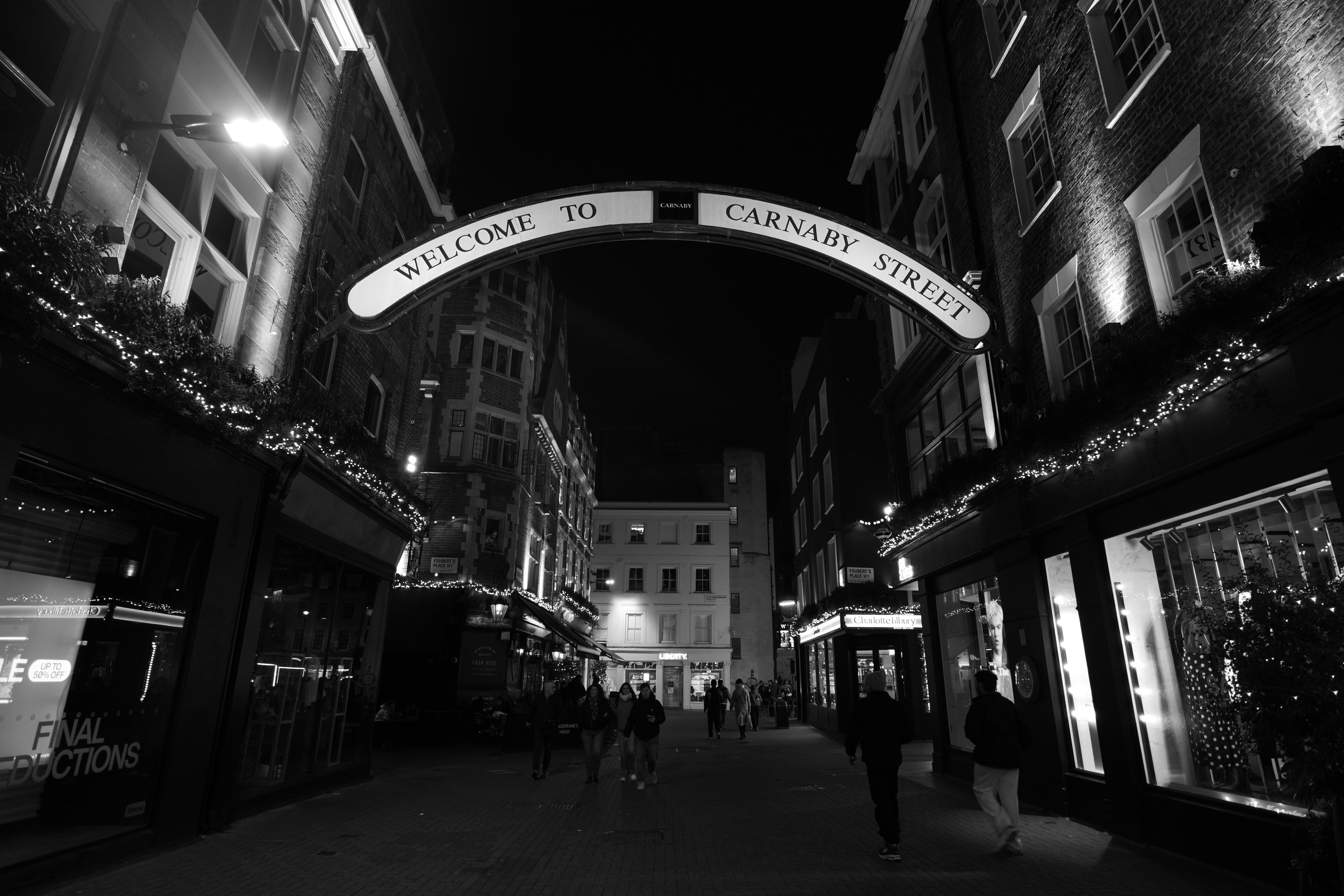 Welcome to carnaby street sign at night